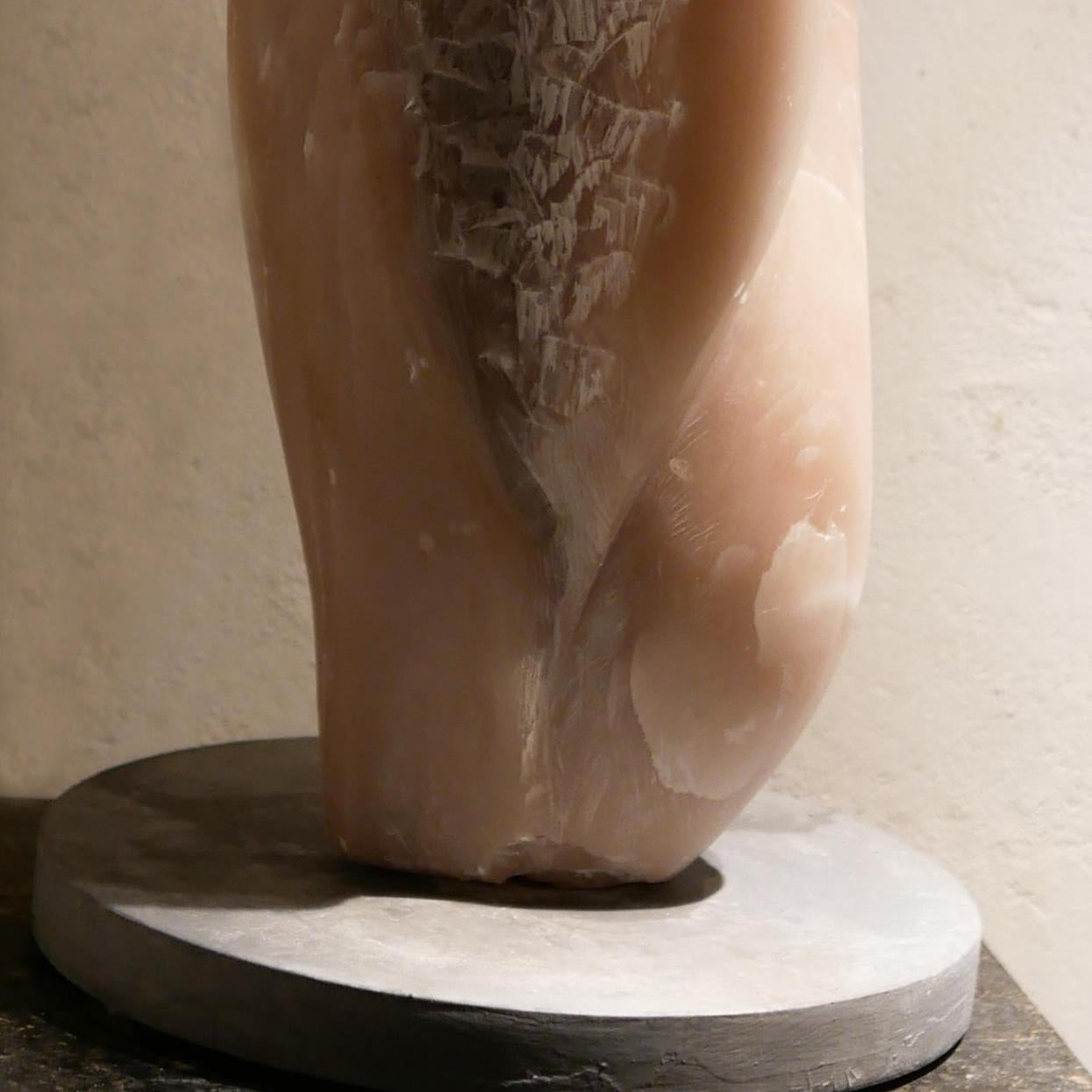 Nicole  Durand is an internationally known stone carver. 
She loves to choose the most beautiful alabaster for their quality, beauty and transparency.
In this piece, she beautifully combines green alabaster and pink steatite leaving the rough of the