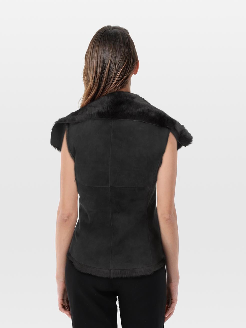 CONDITION is Very good. Minimal wear to the jacket is evident. Mark on the front right of this used Nicole Farhi designer resale item. The brand label is partly detached.
 
 
 
 Details
 
 
 Black¬†
 
 Rabbit fur
 
 Vest
 
 Suede outer
 
 Fur lined
