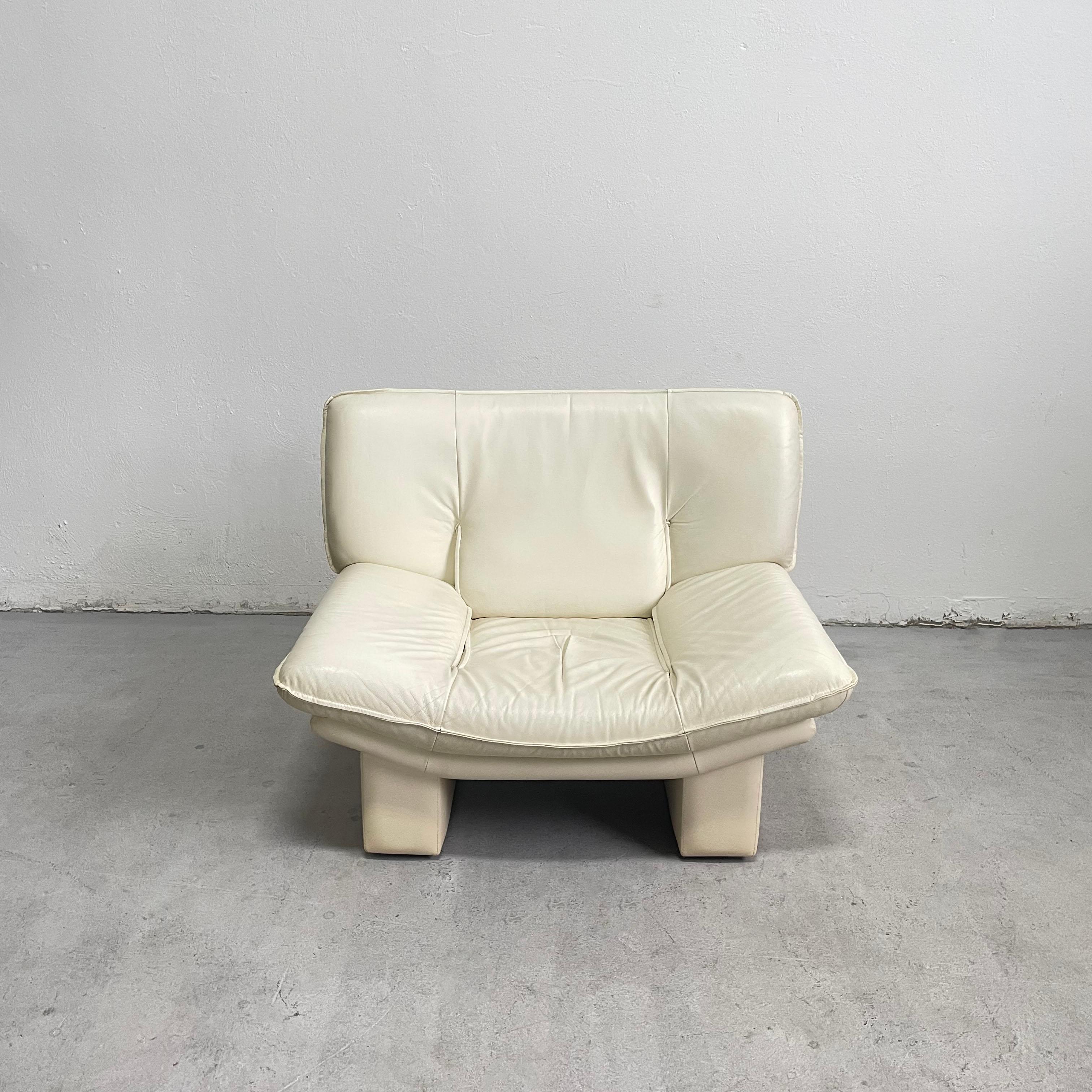 Italian armchair in beautiful ivory white color from the 1980s

This chair features wooden frame and very soft leather/leatherette upholstery

The chair remains in a very good vintage condition, showing just minor traces of cosmetic wear

It's very