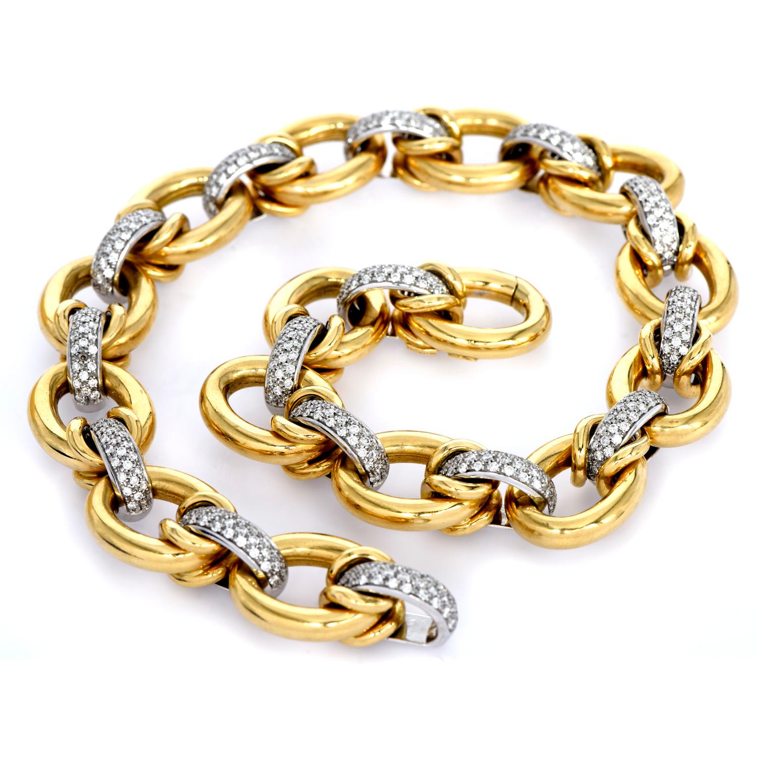 This Luxurious large link necklace was crafted in 

181.5 Grams of 18K yellow & white gold.

Single polished gold rings & cluster diamond links interconnect throughout

Made in Italy, by the designer Nicolis Cola, in the 1980s.

495 round-cut,