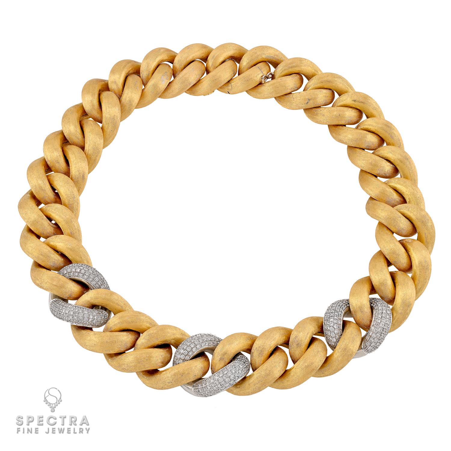 Bold, refined, and unmistakably elegant—this striking link necklace by Nicolis Cola is a statement in Italian craftsmanship. Sculpted in richly brushed 18k yellow gold, the design is accented with three gleaming white gold links set with diamonds,