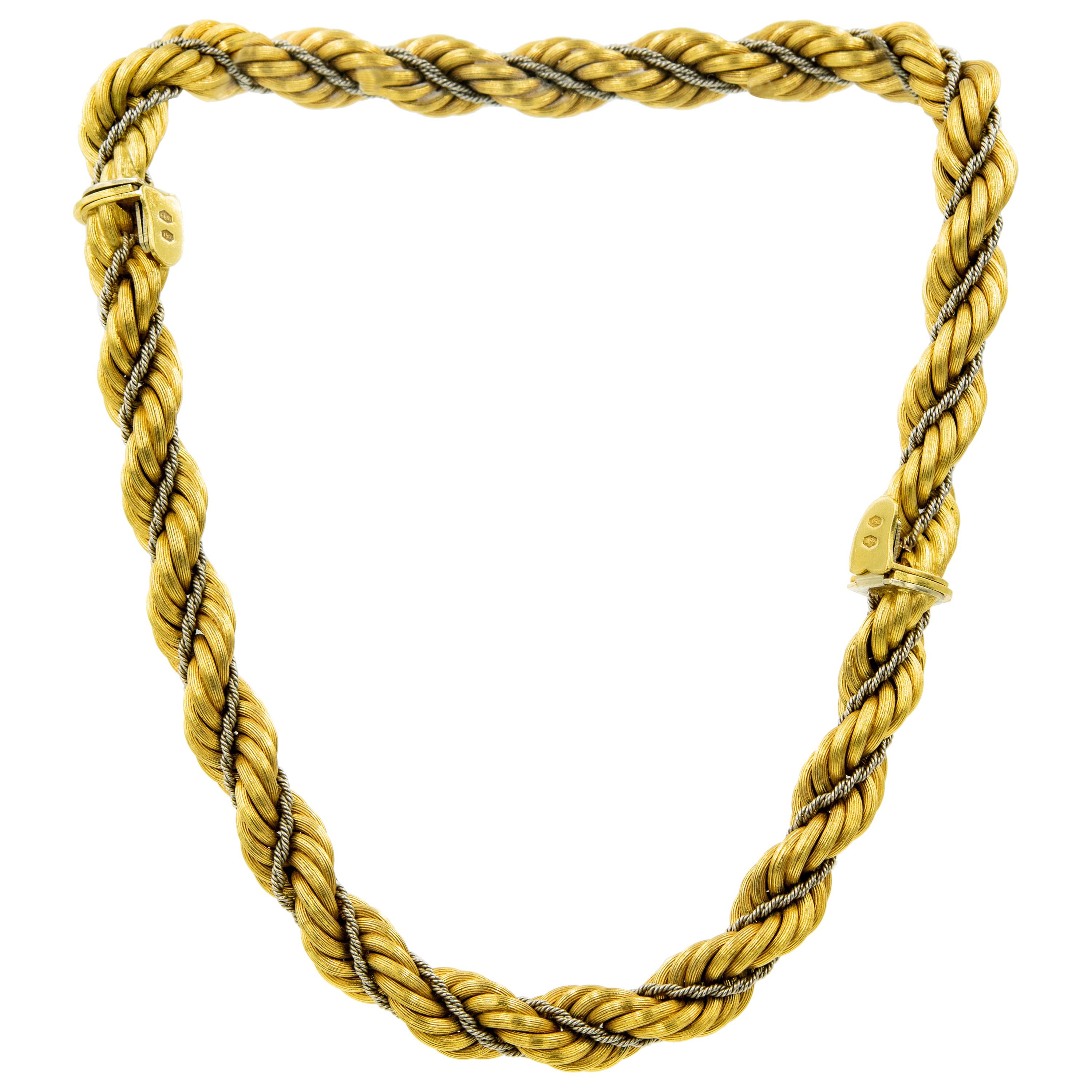 1970s Chic Italian set made by Vincenza jeweler Nicolis Cola. The set includes a 18k pair of bracelets featuring a wider (10.75mm) twisted yellow gold rope chain intertwined with a thinner white gold rope chain. They can be worn as bracelets or as