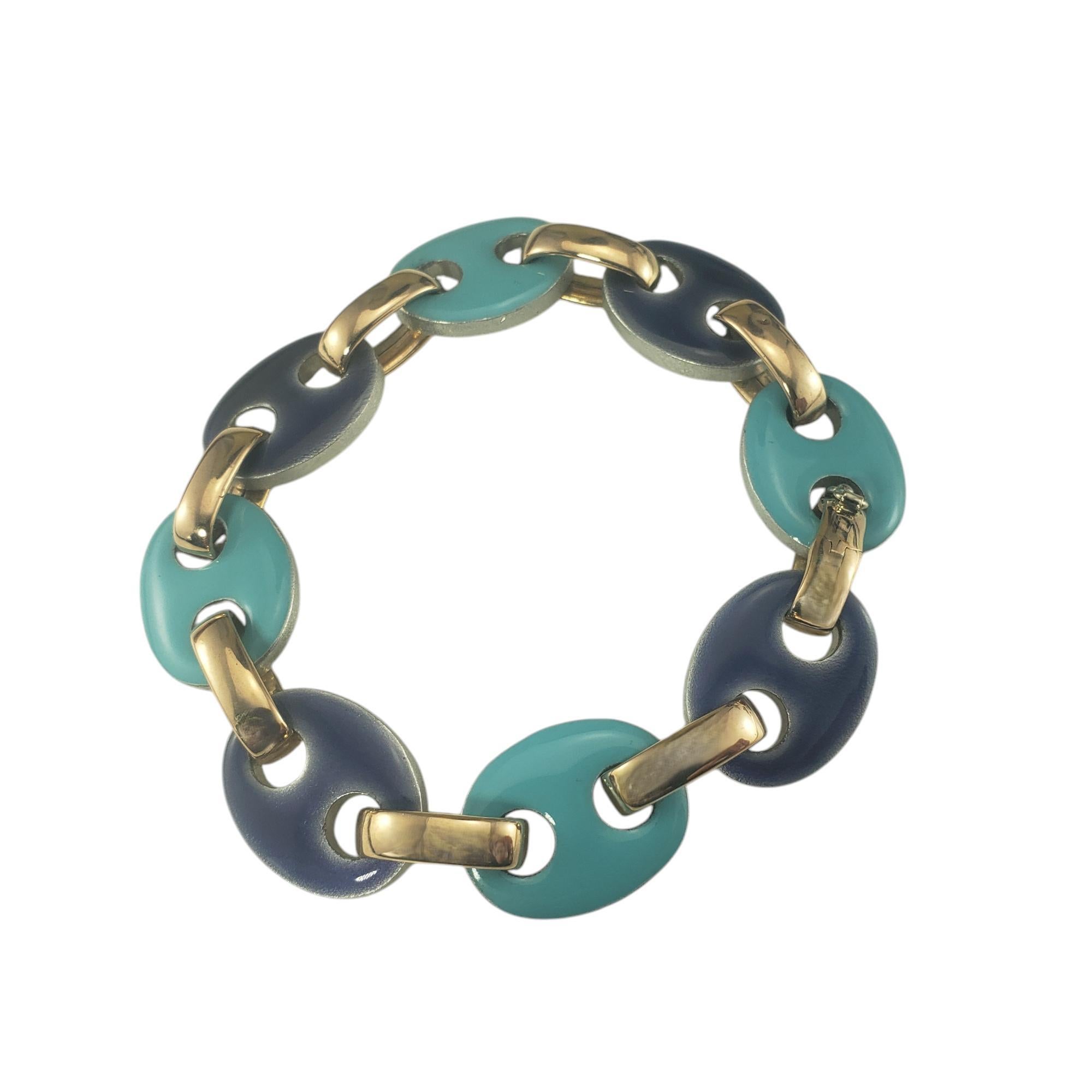 Nicolis-Cola Nardi 18K Yellow Gold and Enamel Bracelet-

This lovely bracelet by Nicolis-Cola features 18K yellow gold links and colorful blue enamel over metal.

Width: 15 mm.

Size: 6.75 inches

Weight: 11.3 dwt/ 17.6 gr

Stamped: 166 VI 750