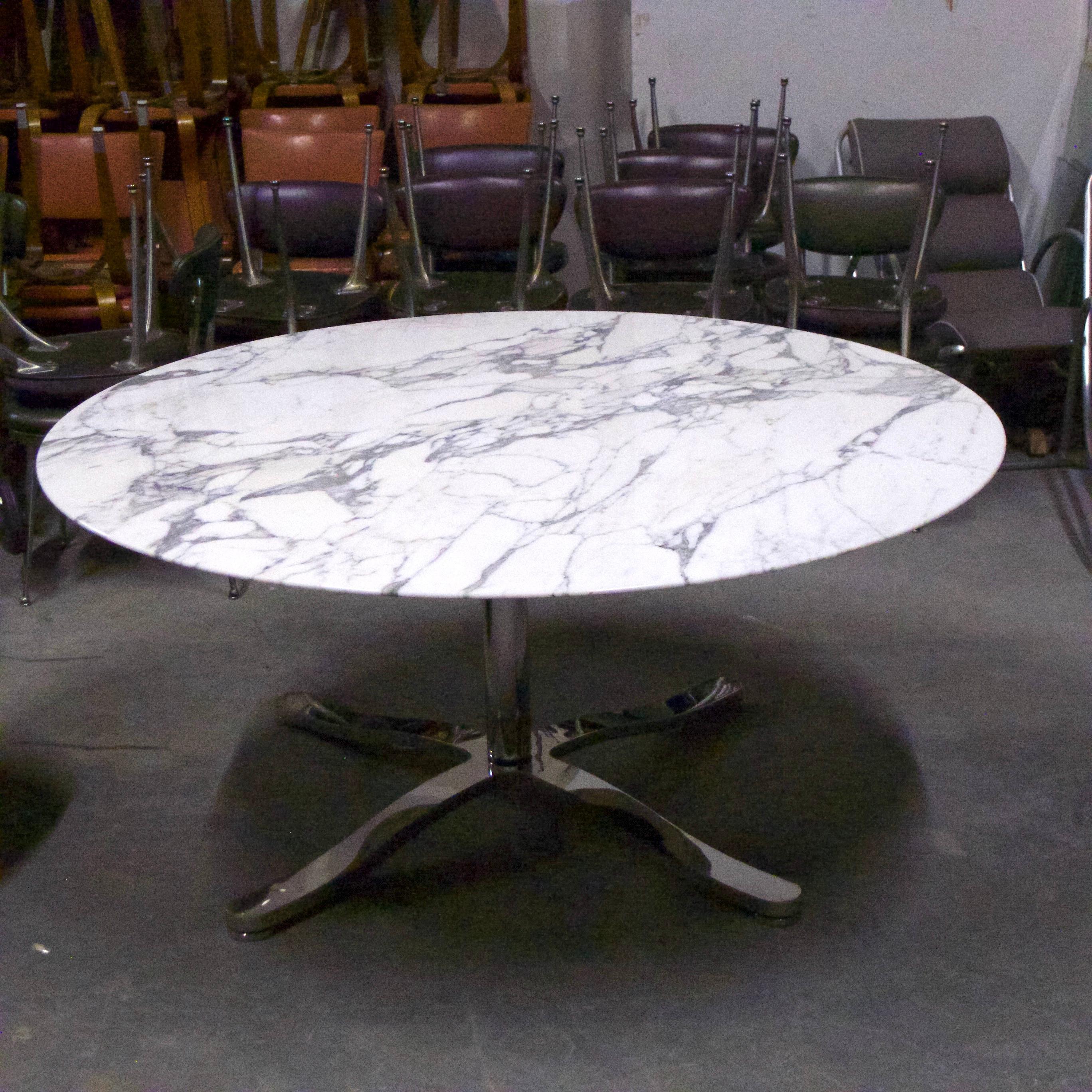 A very impressive and versatile Nicos Zographos Alpha table that could function as a dining, center, or conference table. The top is a beautiful single piece of 5 foot diameter Italian Calacatta marble stone with a beveled edge supported by a