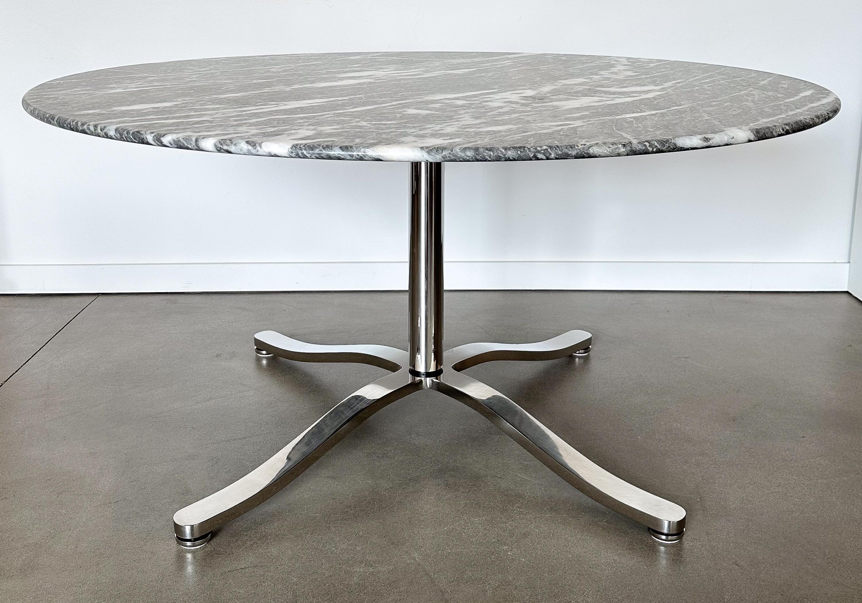 Elevate your dining experience with this exquisite marble dining table by the design maestro, Nicos Zographos. Crafted in the vibrant design era of the 1970s, this table is a stellar embodiment of elegance, precision, and functionality.

Spanning a