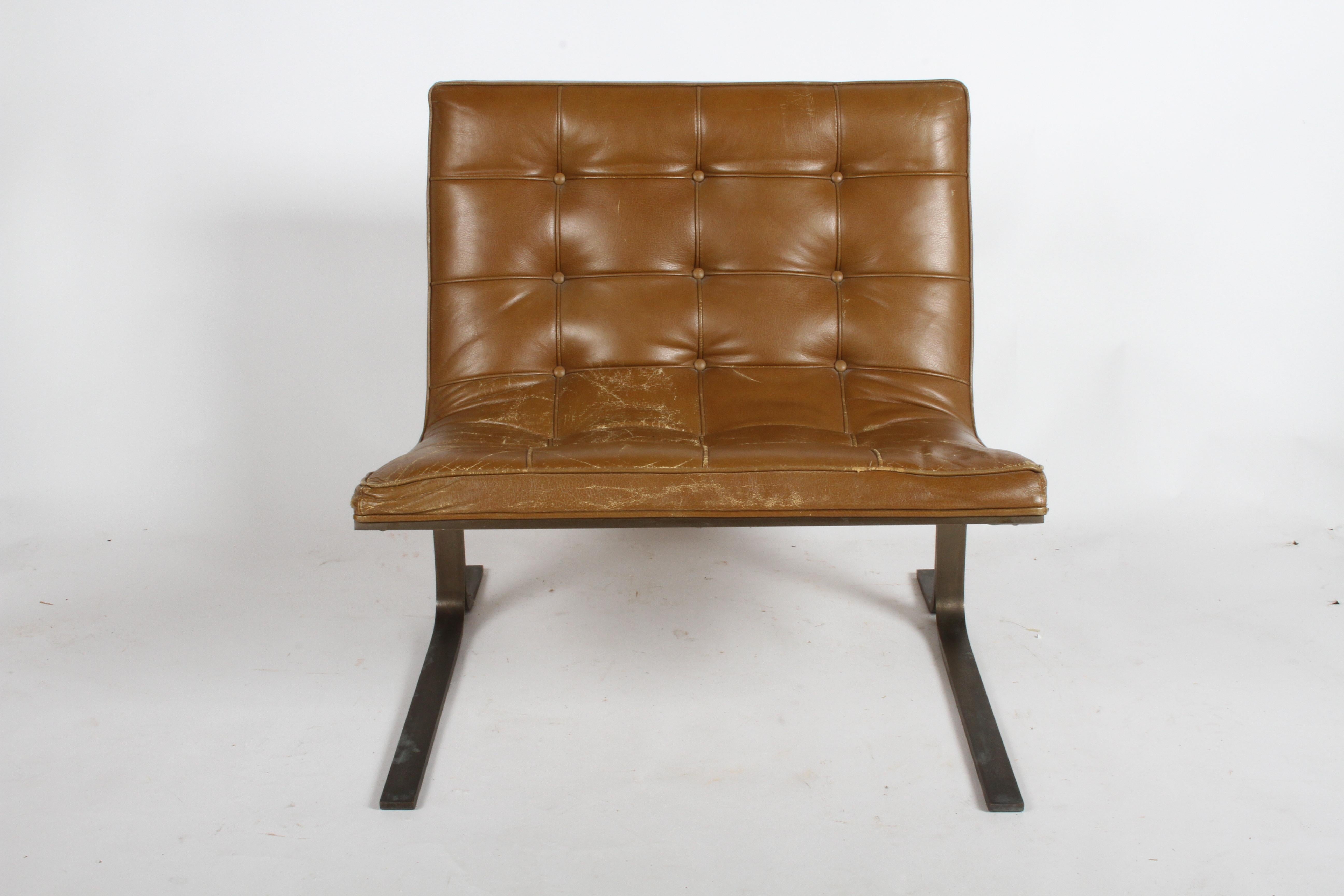 Mid-Century Modern CH28 lounge chairs by architect Nicos Zographos with Carmel tufted leather seats and bronze bases, circa 1960s. Pair available, priced per chair. Designed and manufactured by Nicos Zographos Designs Ltd. Nicos designed this chair