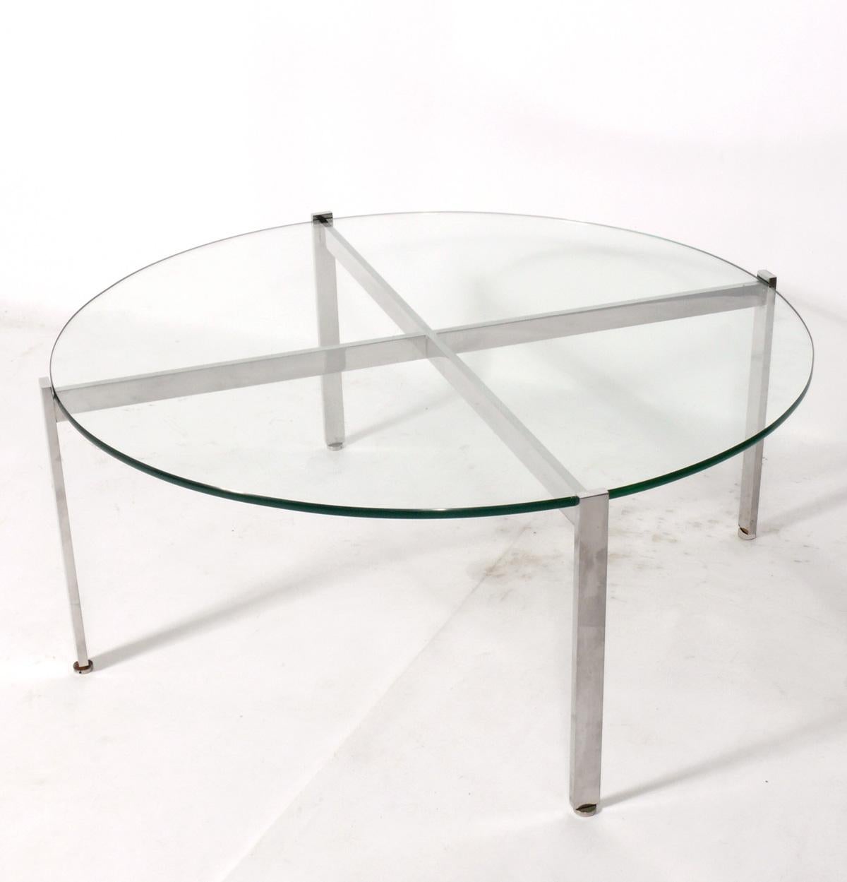 Sleek chrome X-base coffee table, designed by Nicos Zographos, circa 1960s.