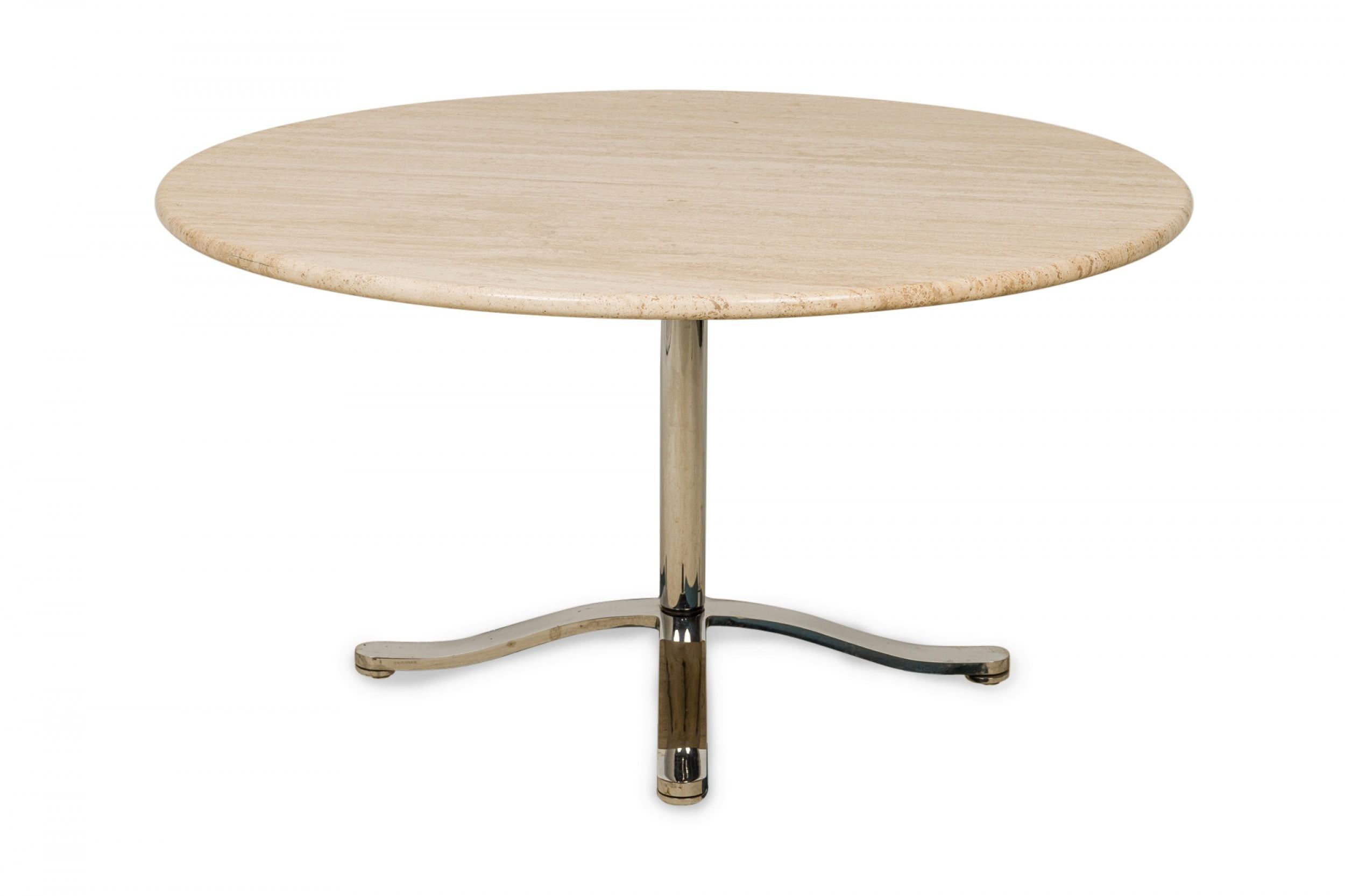 American Mid-Century circular dining table with a travertine top supported by a polished steel pedestal base with an x-shaped foot. (NICOS ZOGRAPHOS)