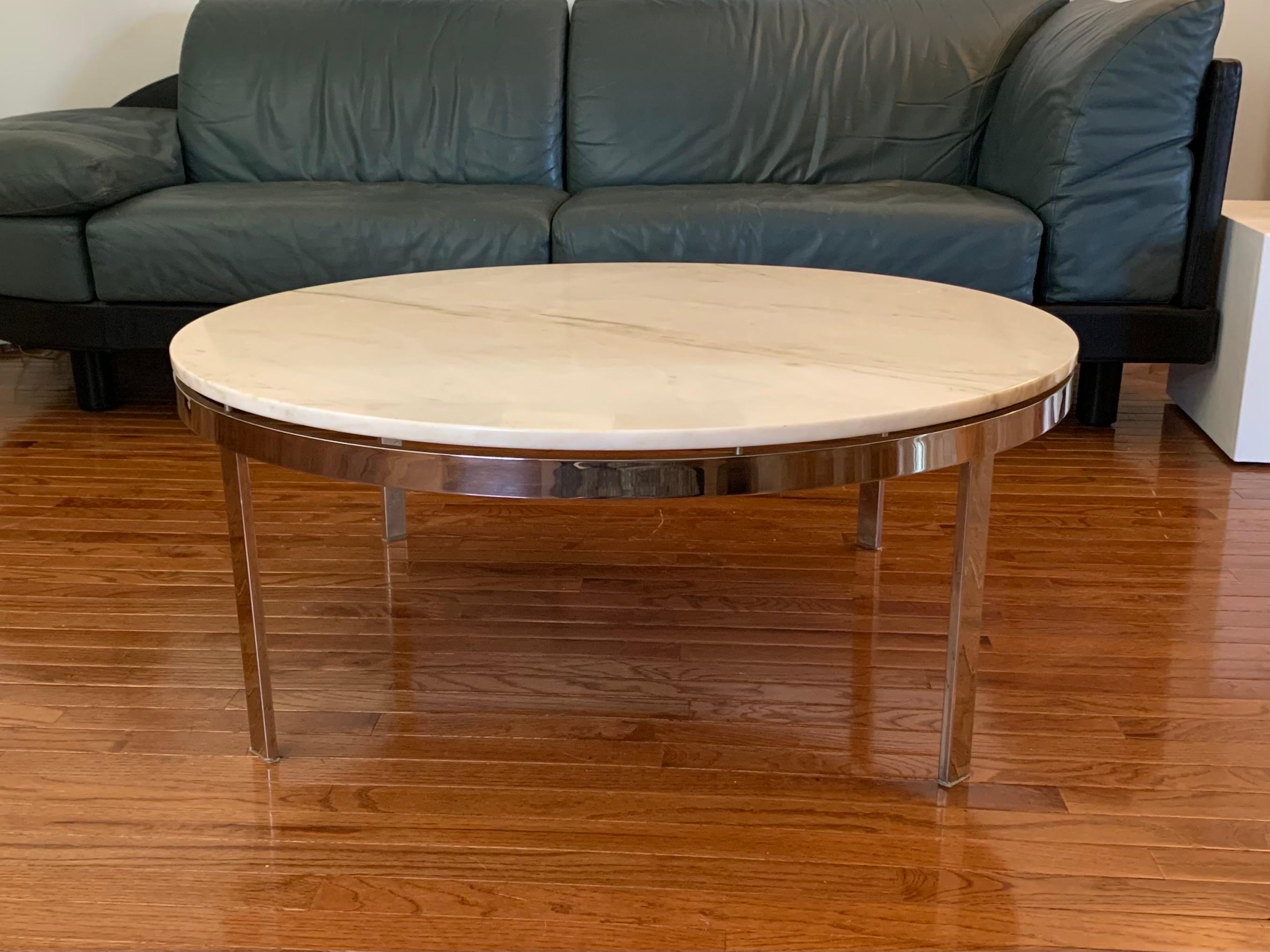 This is a round polished-steel coffee table with a Calacatta Gold marble top, designed by Nicos Zographos and produced by Zographos Designs Limited in the 1970s.

Zographos’ pieces are widely known for their high-quality construction, and the