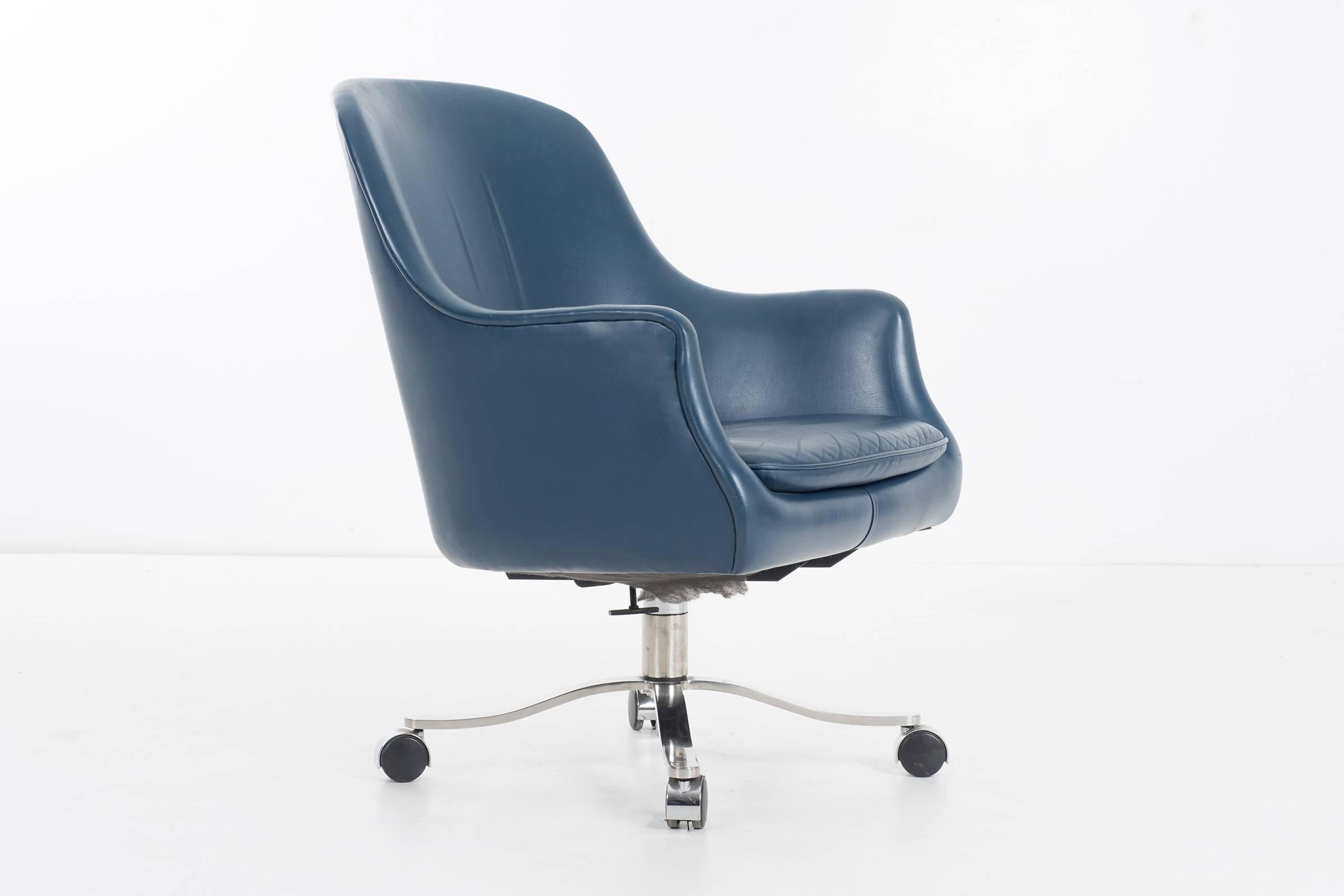 Nicos Zographos office chair with chrome base and blue leather.