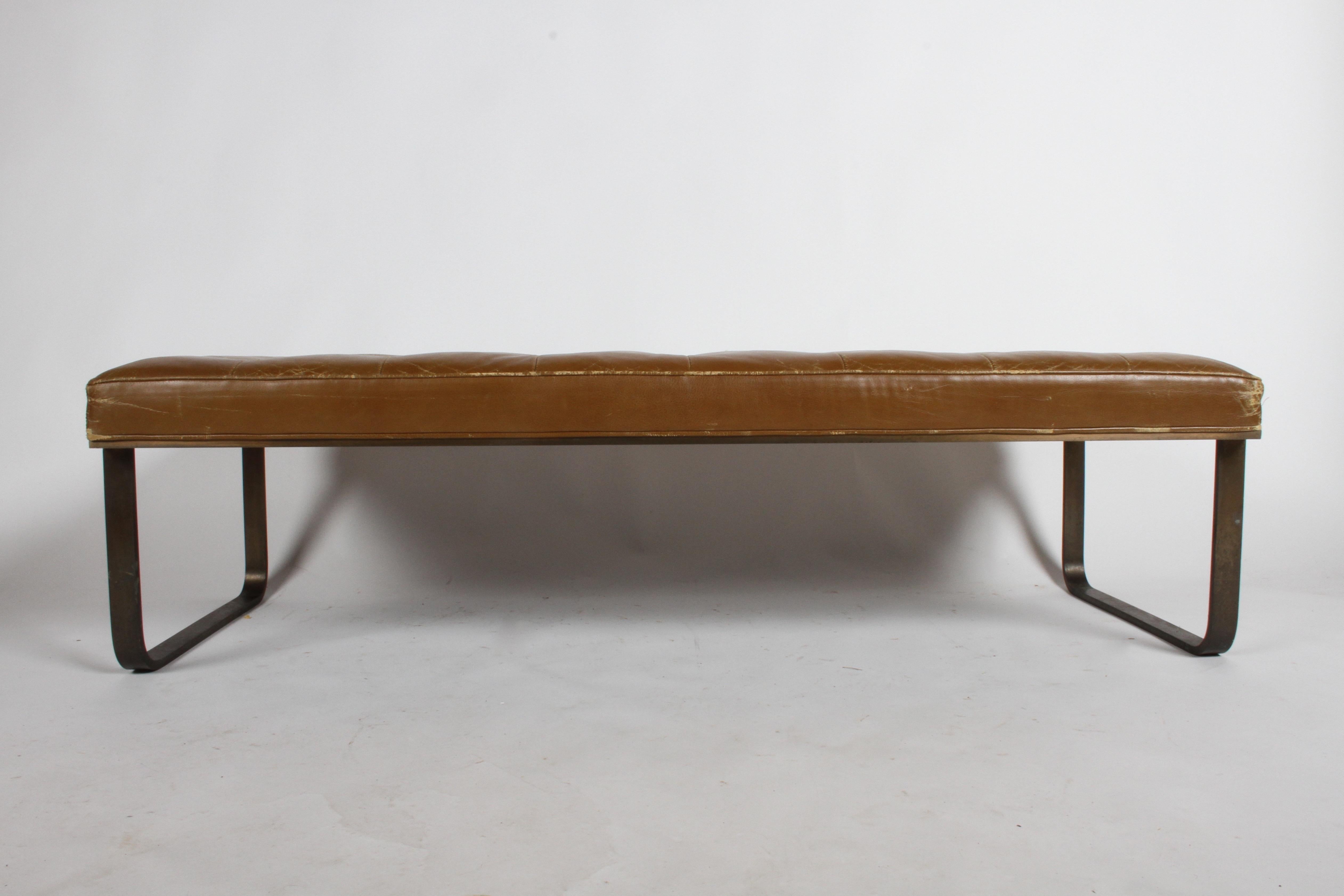 Leather tufted museum bench by Nicos Zographos with bronze base, circa 1965. Leather shows wear but no holes, bronze has patina. Label. Midcentury, Florence Knoll style.