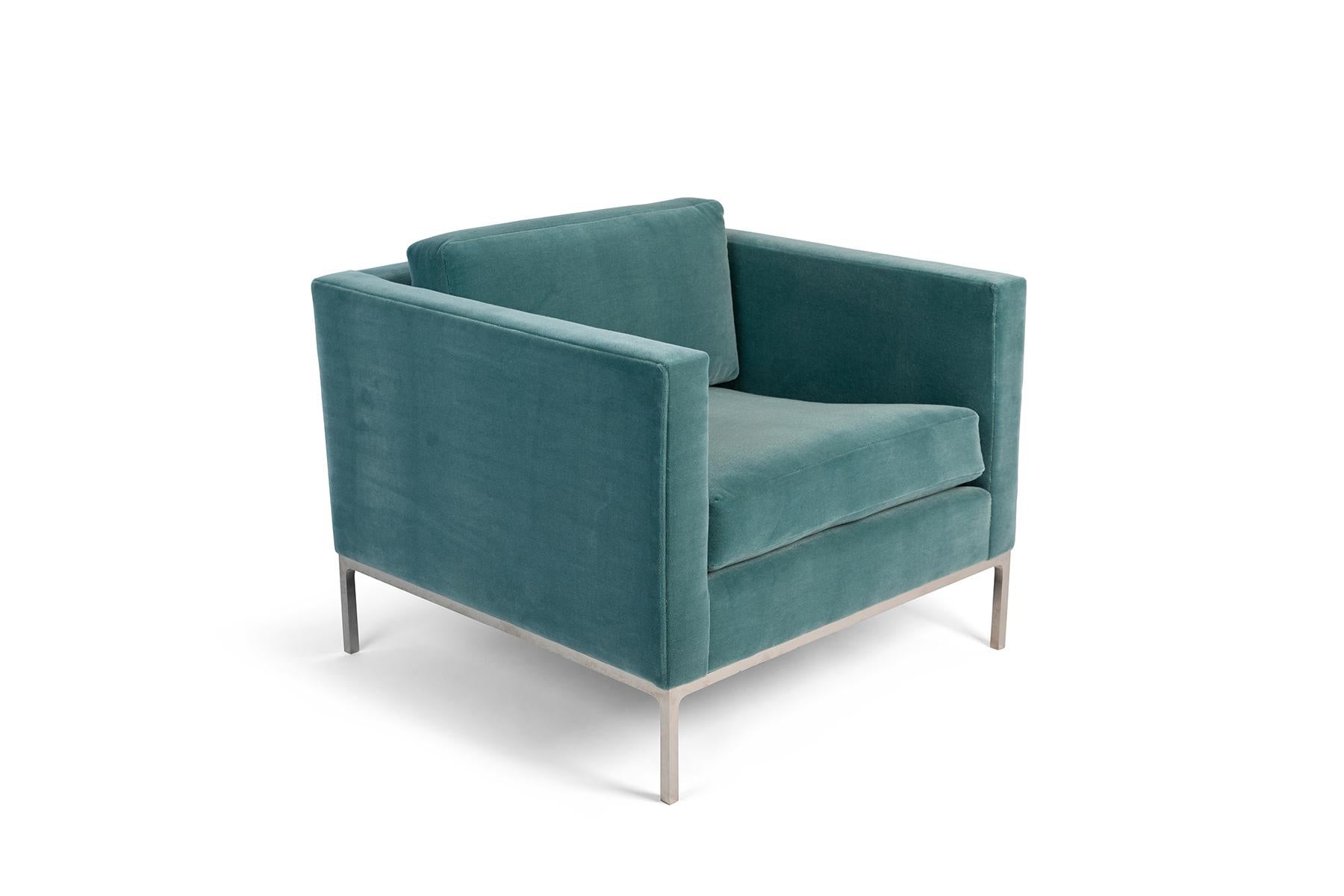 Pair of Nicos Zographos club chairs newly upholstered in an aquamarine sea foam colored mohair with polished chrome legs. Price listed is for the pair.