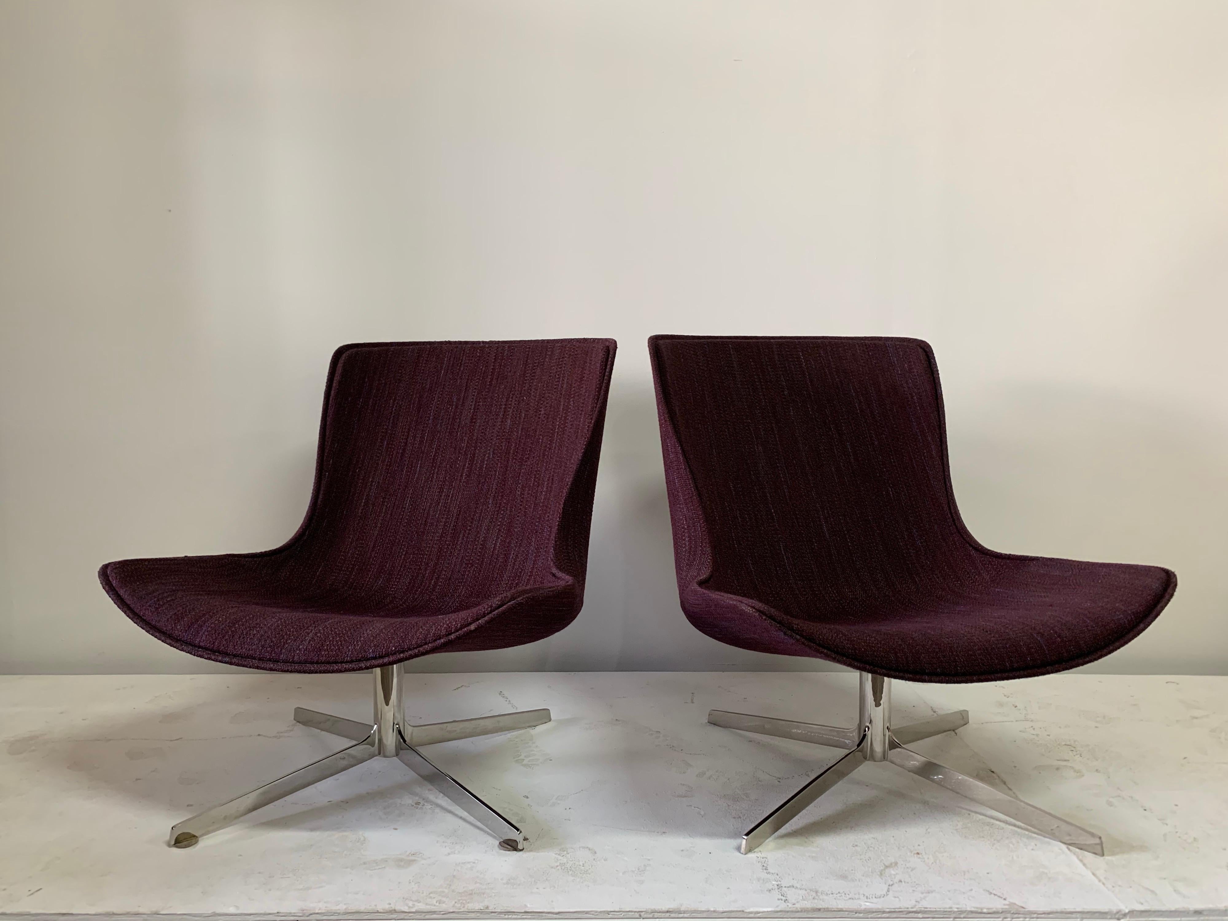 In the original eggplant fabric and with the most beautiful curves design, these Zographos style swivel lounge chairs on stainless steel base. They are ready to use and very comfortable with full 360 swivel. Very high quality and craftsmanship.