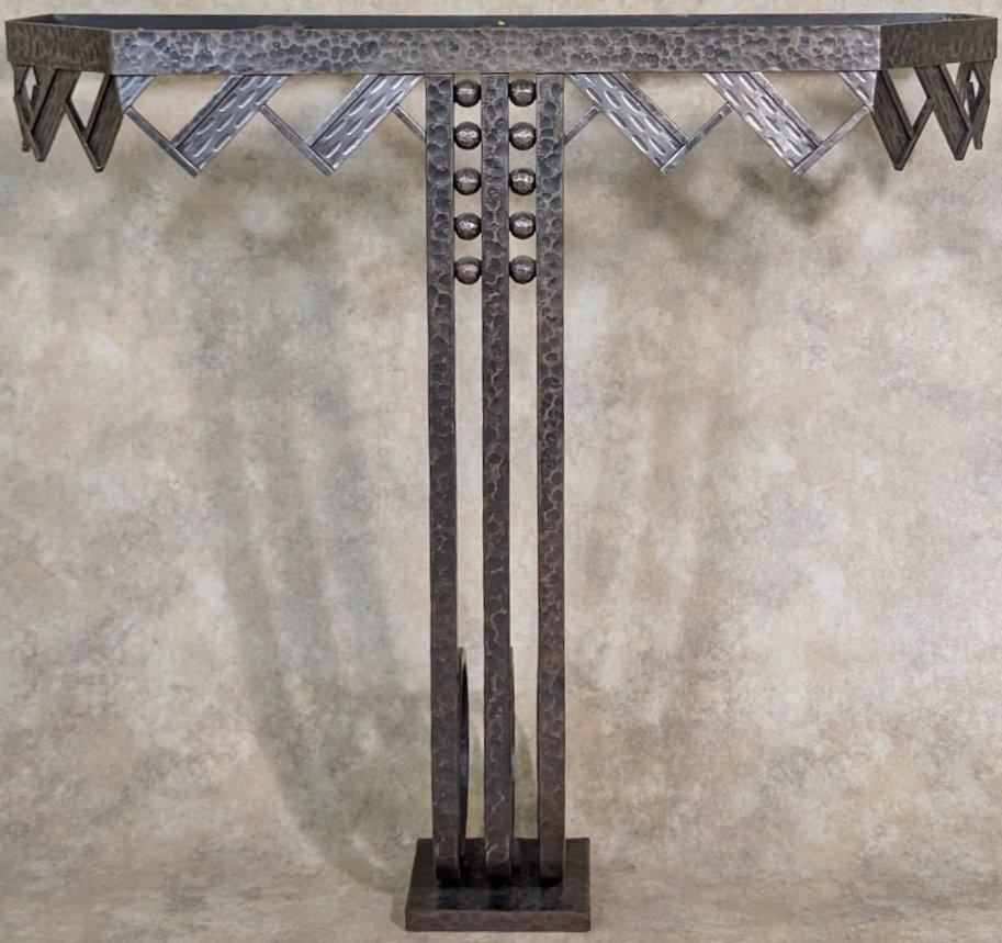 Classic French Art Deco console by Nics Freres, circa 1925, in forged iron 38” wide x 34” high x 16” deep. 

The Nics brothers, Michel and Jules, were Hungarian metalworkerss and furniture makers, were active in Paris beginning in the later years of