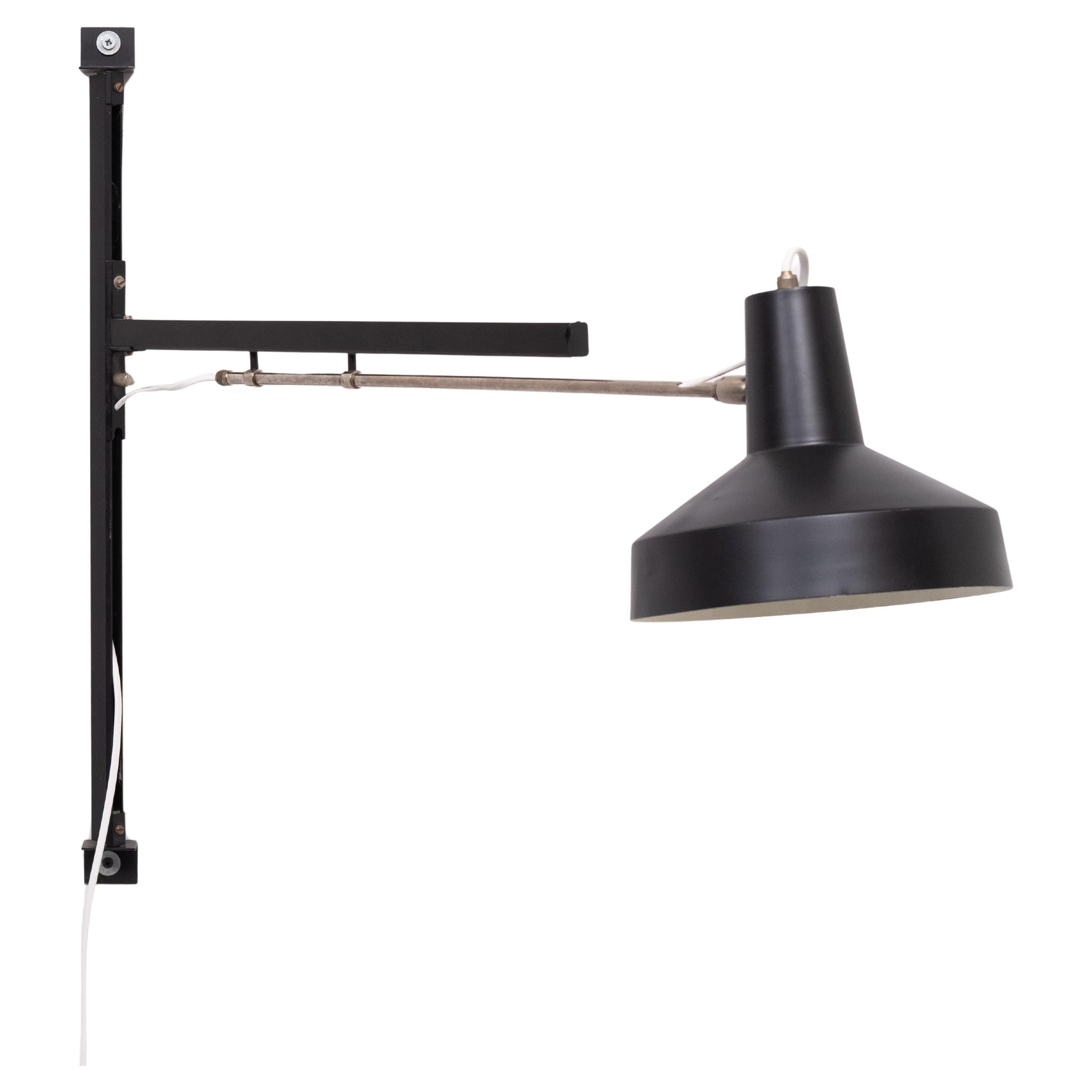 We have found this beathiful Dutch design wall lamp designed by Niek Hiemstra and produced by Hiemstra Evolux. It is nicknamed the “telescope” wall lamp, the lamp has a telescopic adjustable arm, hence the name  The lamp is mounted to the wall and