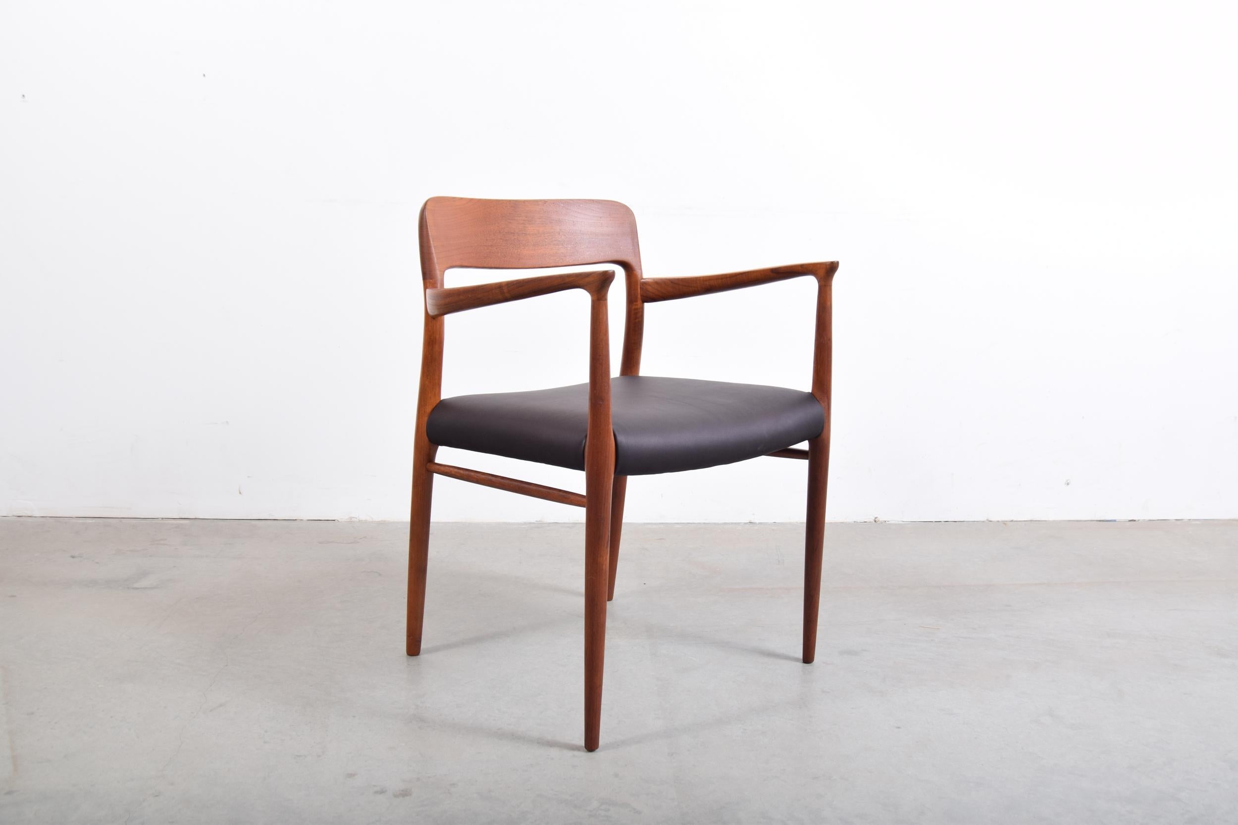 Niels Moller teak armchair, model 56, circa 1960, with black leather seat. Solid teak frame with newly upholstered seat in Edelman leather. Measure: 22.5