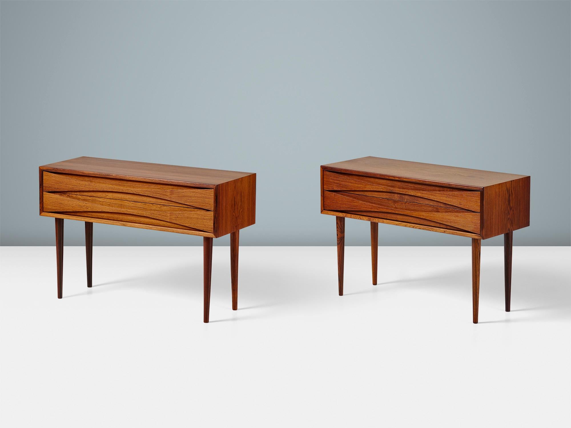 Niels Clausen - Pair of Wide Nightstands, c1960s

A stunning pair of wide Rosewood bedside chests designed by lesser-known Danish cabinetmaker: Niels Clausen for his own company: NC Mobler in Odense, Denmark. Each piece has two drawers with his