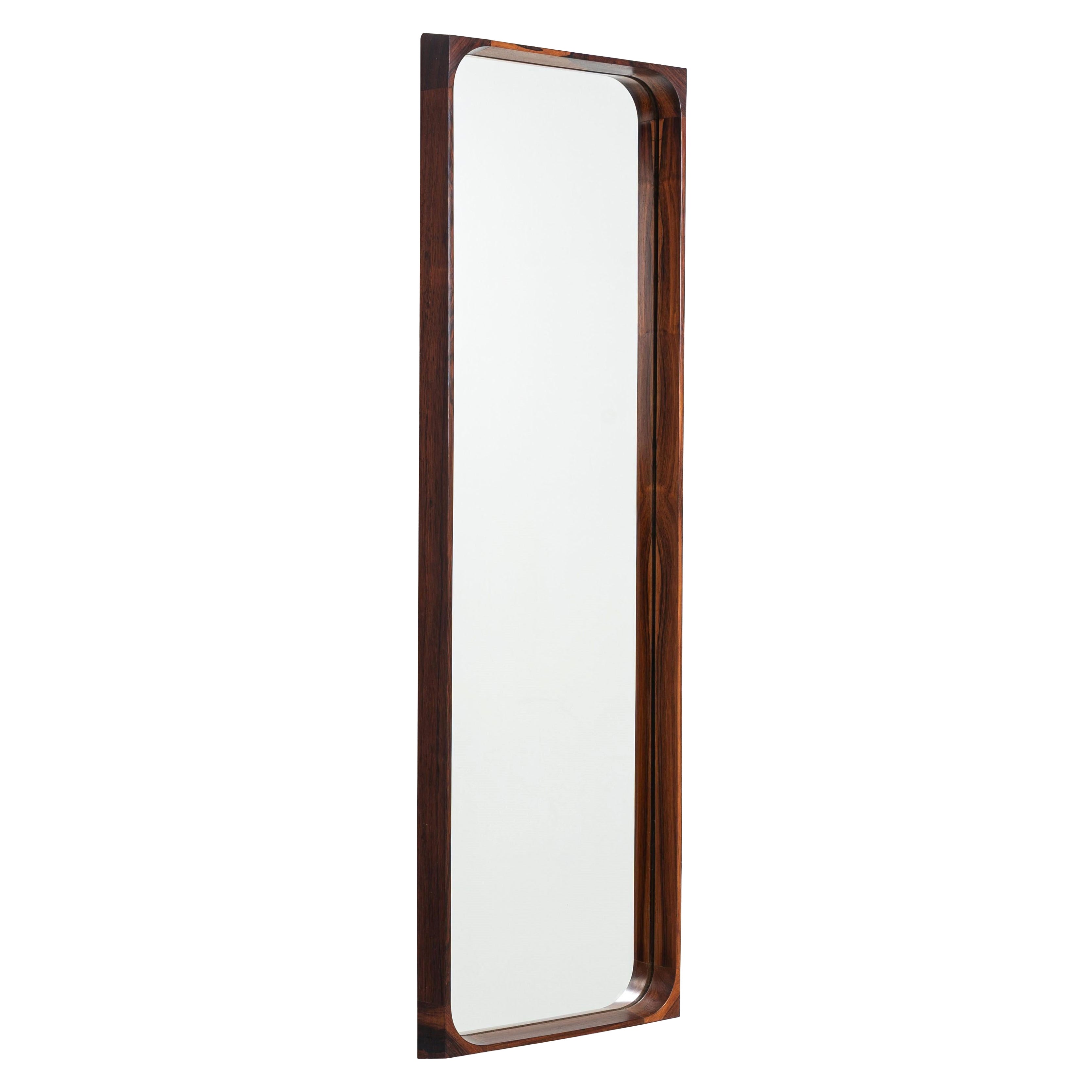 Niels Clausen wall mirror in rosewood for NC Møbler, Denmark, 1960s. A refined e