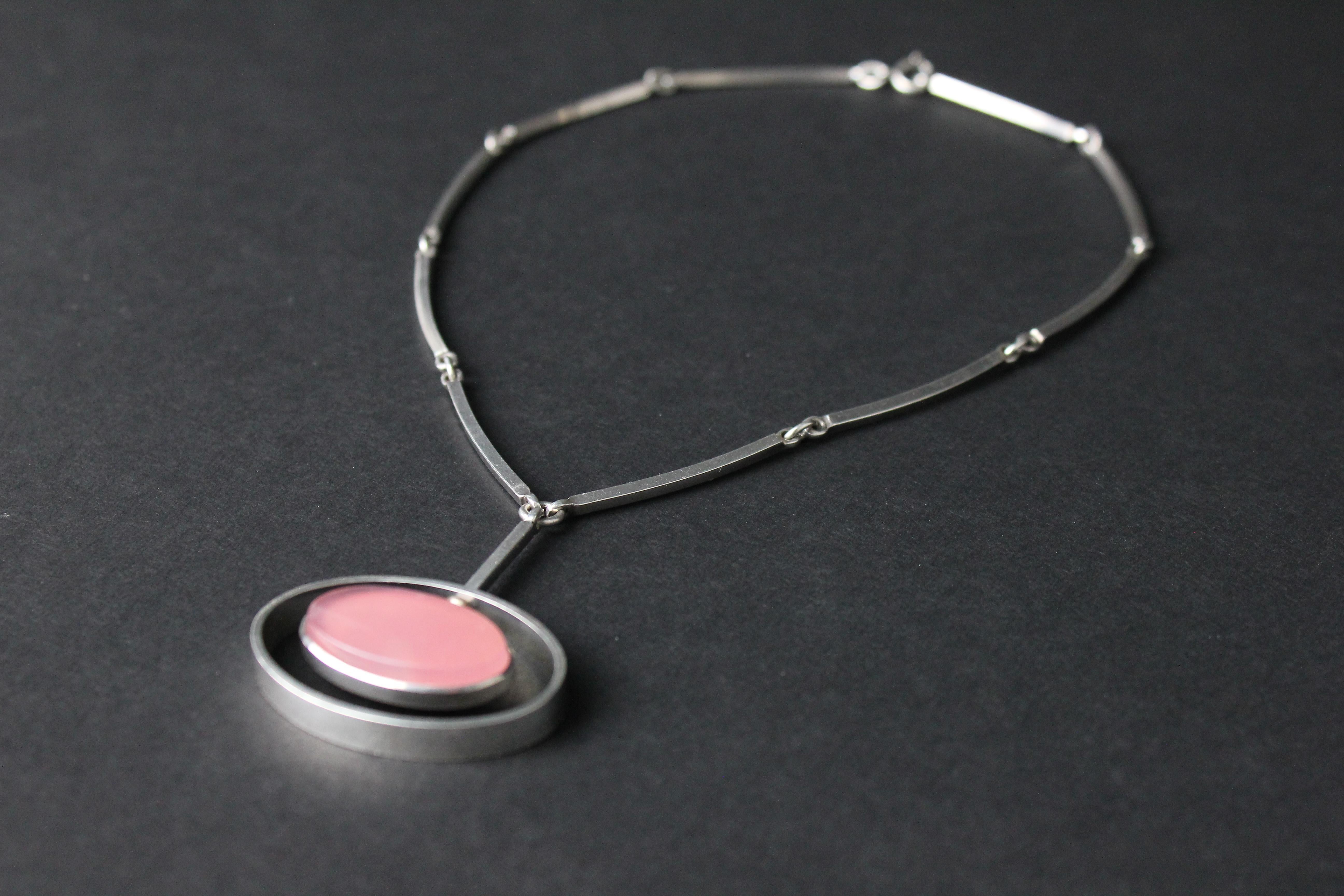 Very modern and stylish necklace by famous Danish firm NE From.
The length of the pendant is 5cm, 4cm wide. Flat oval cut rose quartz.
Very good condition.

NIELS ERIK FROM
The Danish silversmith Niels Erik From opened his studio in 1931 at the age