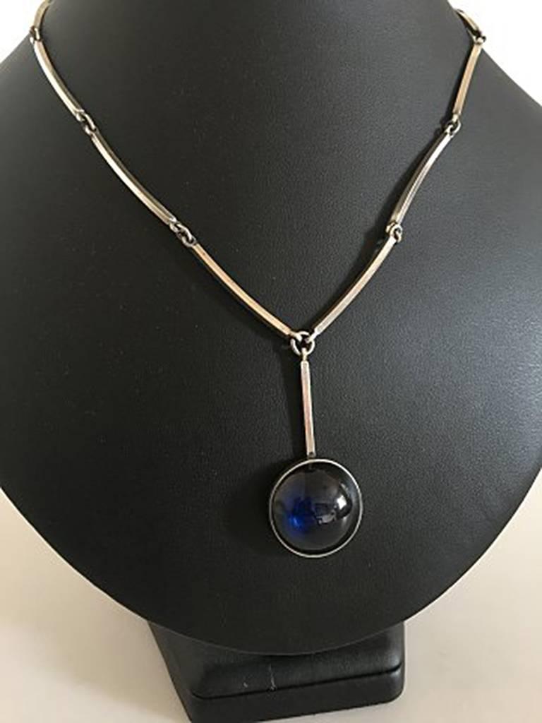 Niels Erik From Sterling Silver Necklace with Blue Stone. Chain measures 44 cm / 17 21/64 in. Pendant measures 2.2 cm diameter / 0 55/64 in.