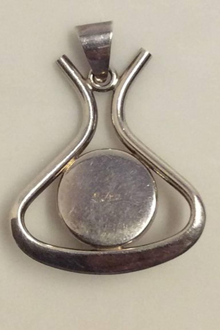 Niels Erik From Sterling Silver pendant with amber. Measures 3.7 cm x 3 cm / 1 1/2 in x 1 3/16 in. Weighs: 7.79 g / 0.27 oz. No chain.