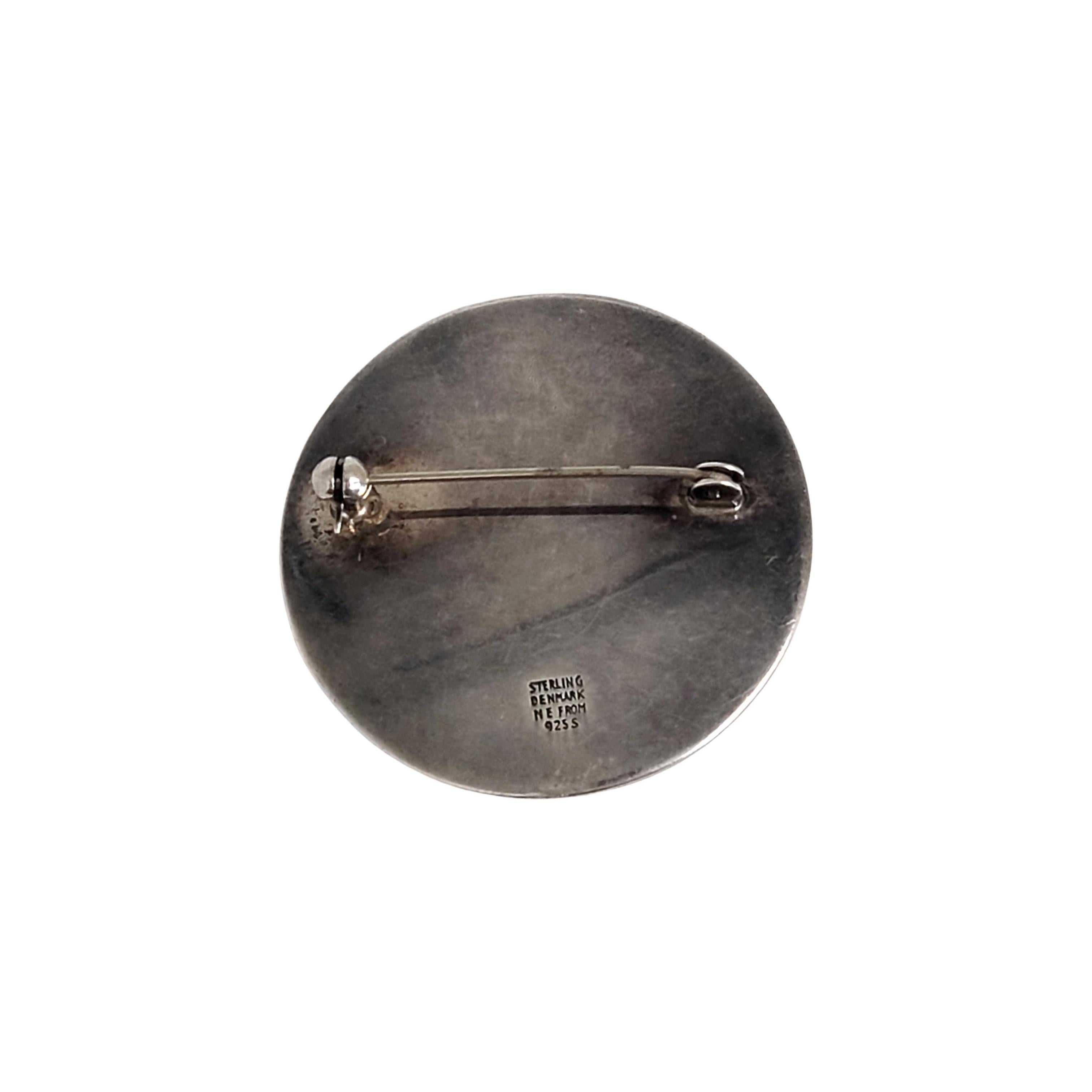 Vintage sterling silver round circle pin/brooch by Niels Erik From (NE FROM) of Denmark.

Niels Erik From was one of the great Danish silversmiths and designers from 1931 thru his death in the 1980s. He created many floral and nature inspired design