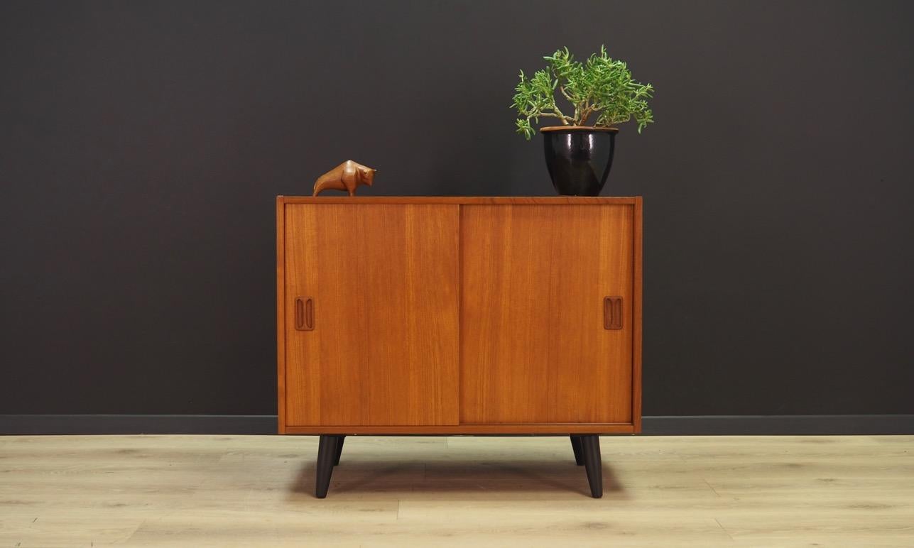 Exceptional cabinet from the 1960-1970s. Scandinavian design, Minimalist form. Designed by Niels J. Thorso. Surface of the furniture finished with teak veneer. Shelf behind a sliding doors. Maintained in good condition (minor bruises and scratches)