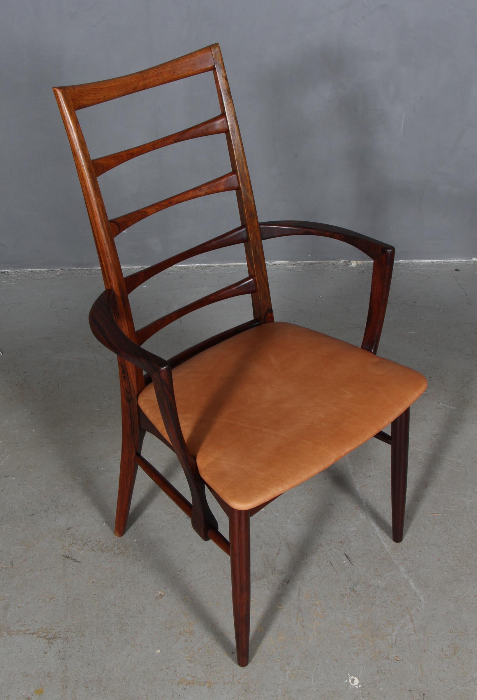 Niels Koefoed armchair made in solid rosewood.

New upholstered in vintage tan aniline leather.

Model Lis, made by Niels Koefoeds Møbelfabrik Hornslet, 1960s.

