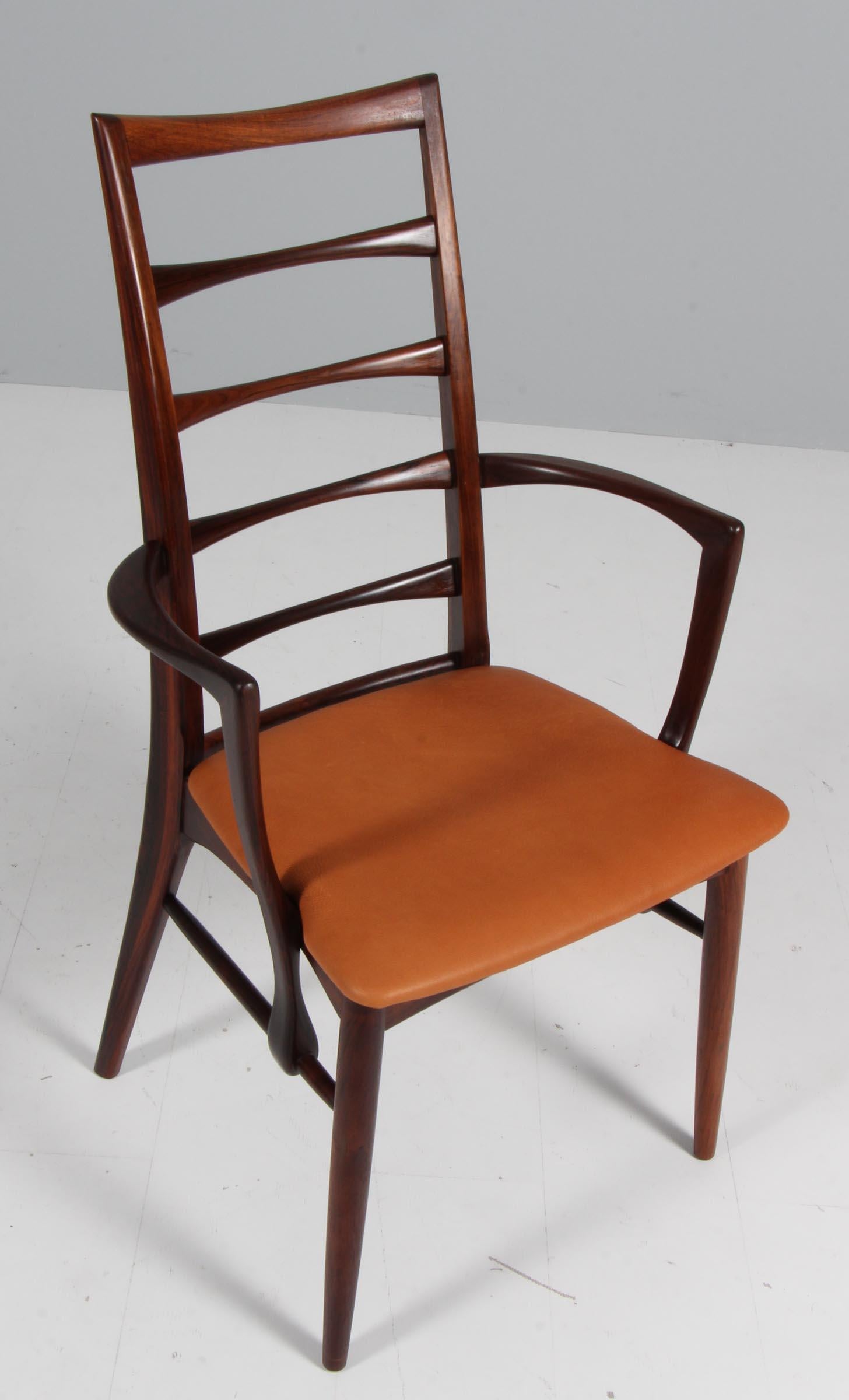 Niels Koefoed armchair made in solid rosewood.

New upholstered in vintage tan aniline leather.

Model Lis, made by Niels Koefoeds Møbelfabrik Hornslet, 1960s.

