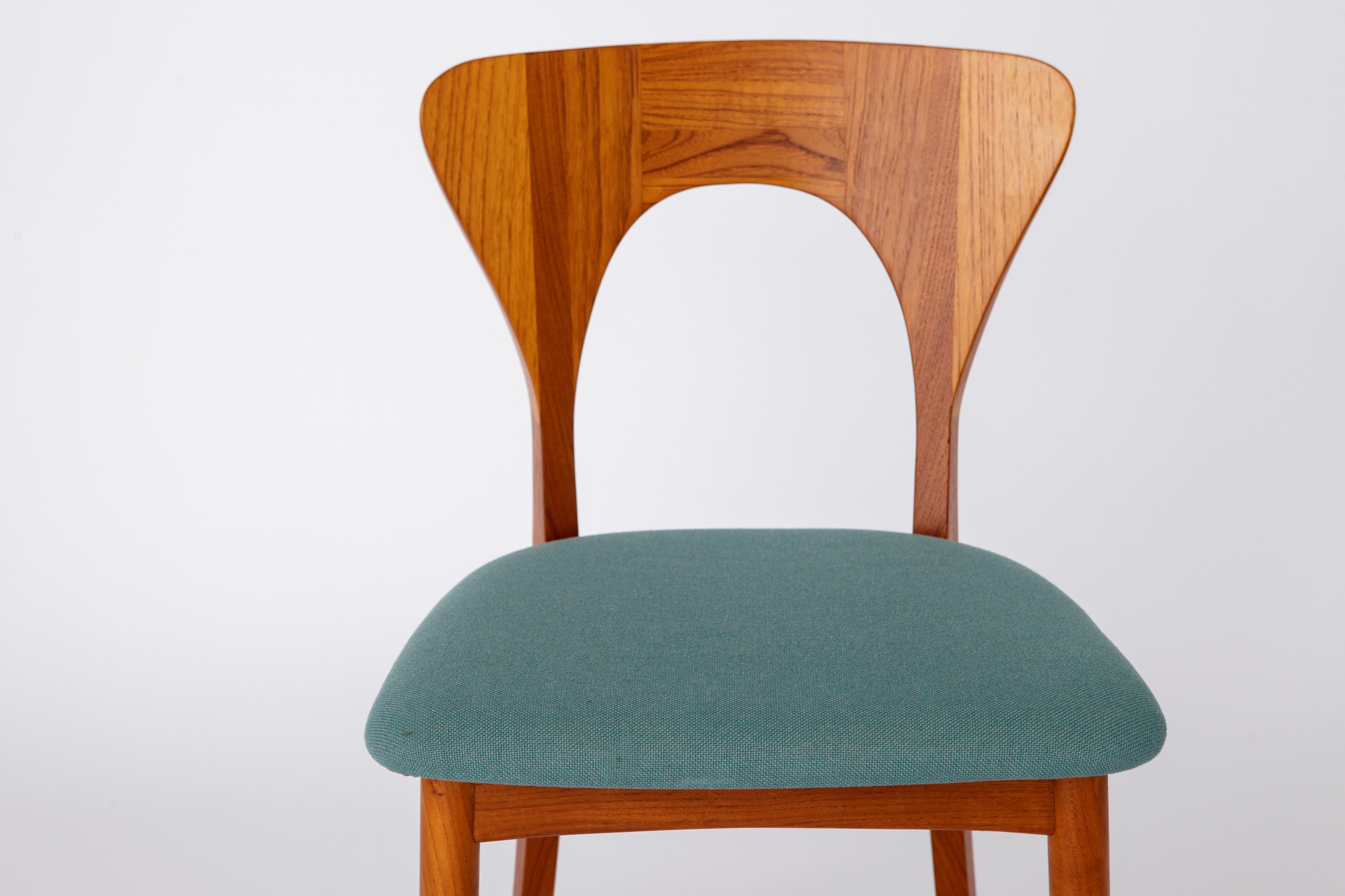 Single vintage chairs by Niels Koefoed. 
Model: Peter
Production period: 1960s

Stable teak chair frame. No cracks or defects in the wood. 
Textile seat cover. 
Manufacturer's mark under the seat. 