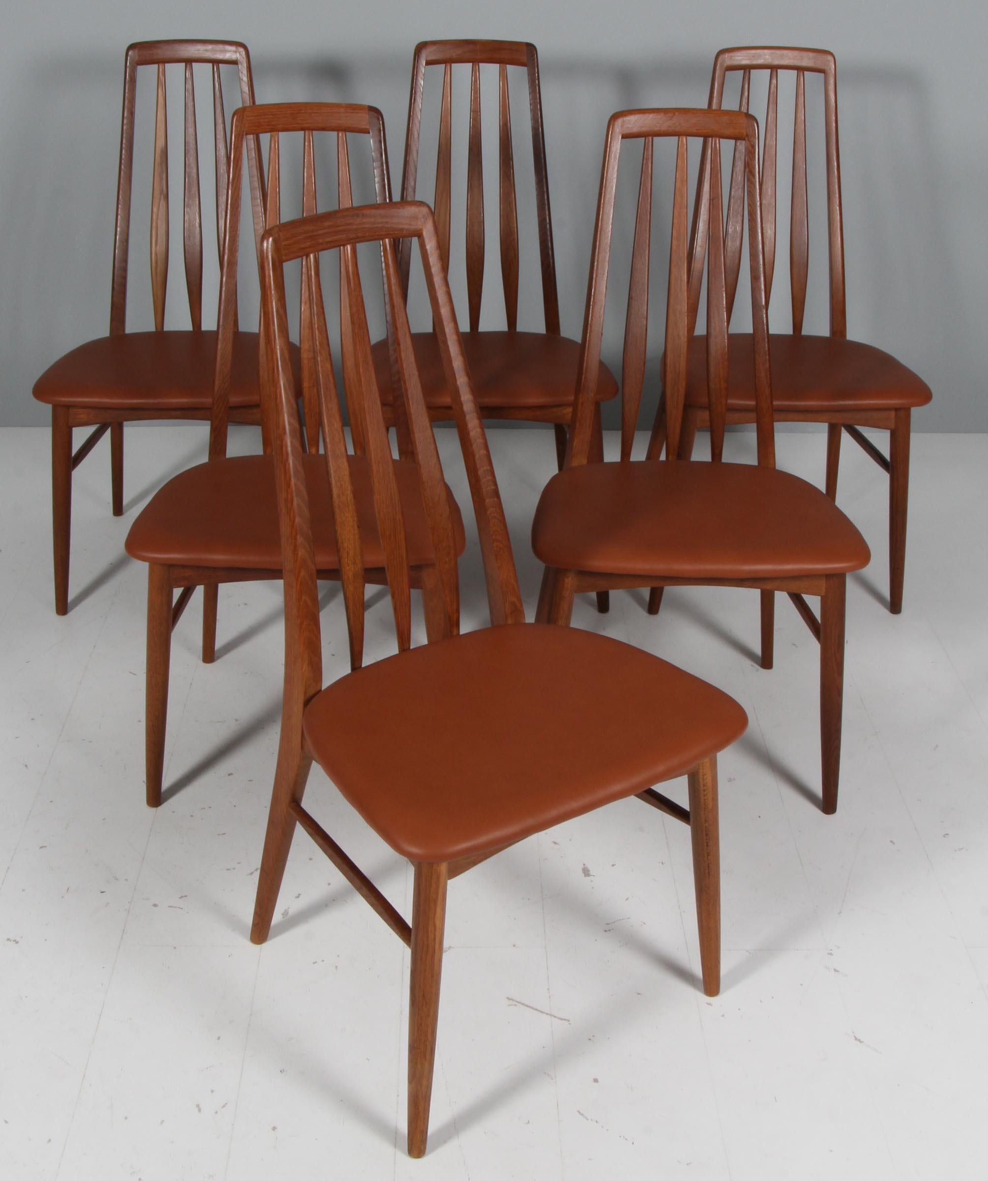 Niels Koefoed dining chairs made in solid oak.

New upholstered in cognac full grain aniline leather.

Model Eva, made by Niels Koefoeds Møbelfabrik Hornslet, 1960s.

