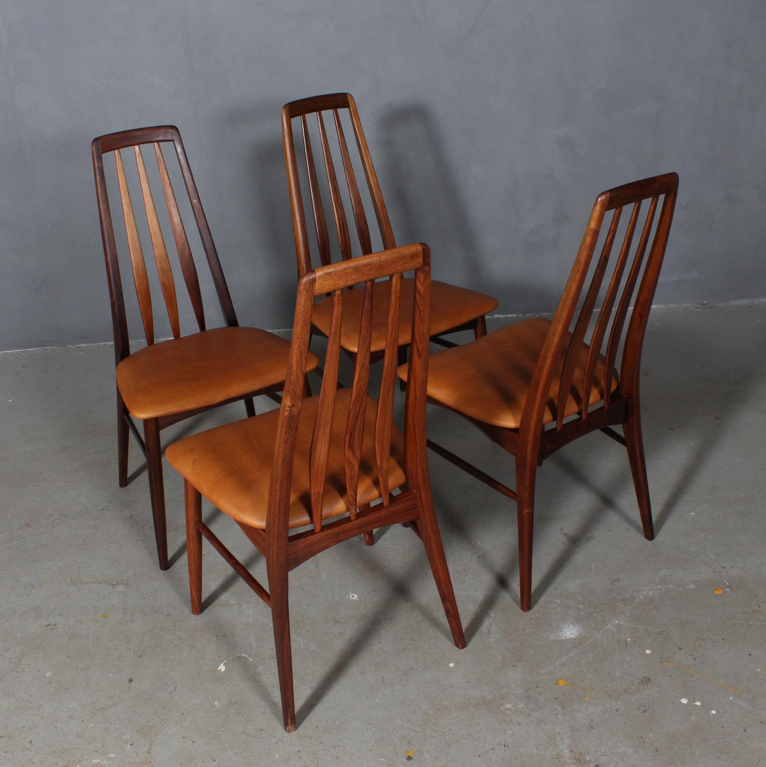 Niels Koefoed dining chairs made in solid rosewood.

New upholstered in tan vintage aniline leather.

Model Eva, made by Niels Koefoeds Møbelfabrik Hornslet, 1960s.

