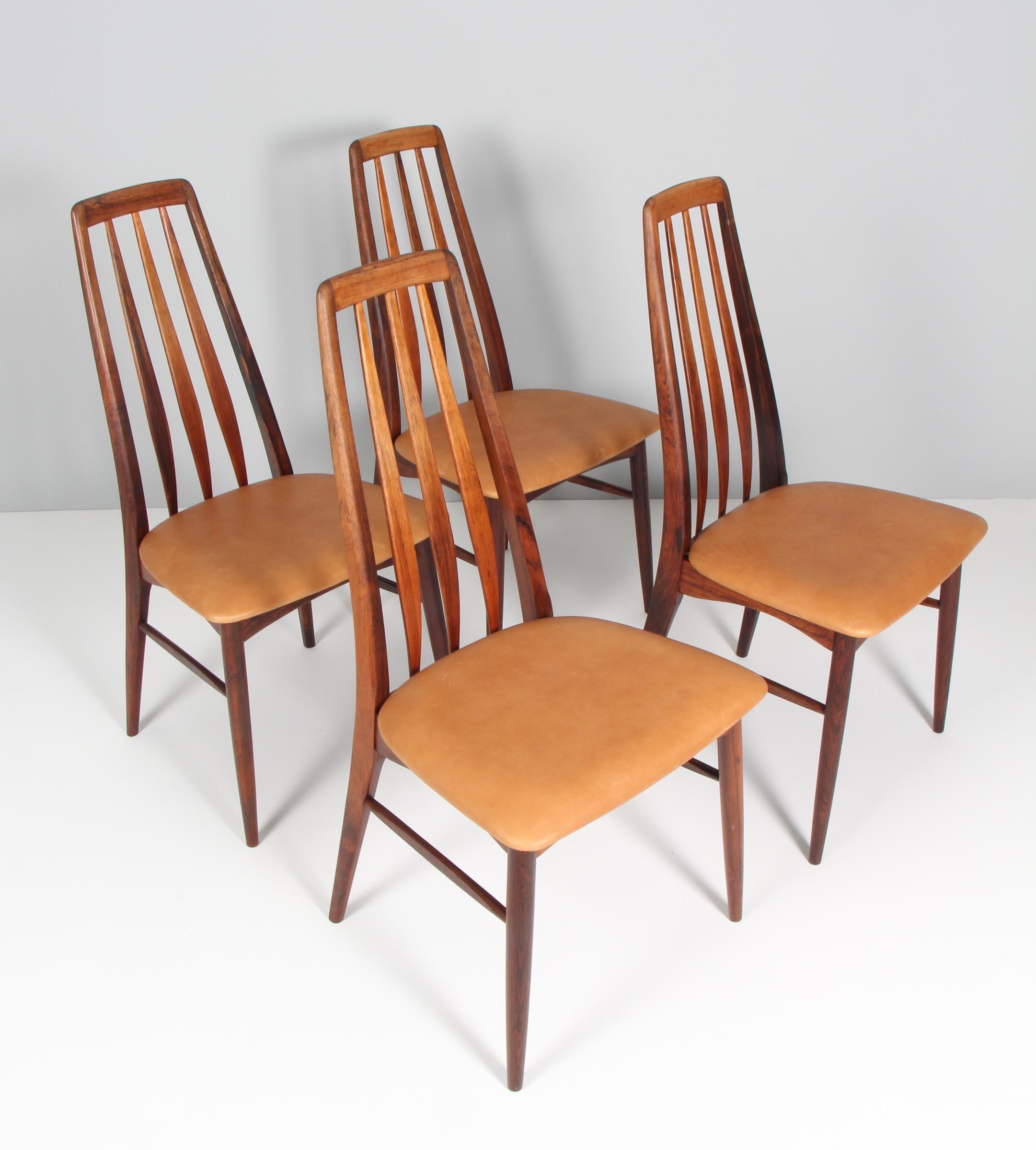 Niels Koefoed dining chairs made in solid rosewood.

New upholstered in tan vintage aniline leather.

Model Eva, made by Niels Koefoeds Møbelfabrik Hornslet, 1960s.


