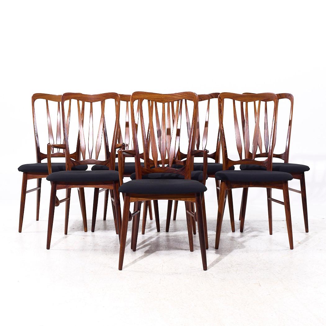Niels Koefoed per Koefoeds Hornslet Ingrid - Set di 8 sedie da pranzo danesi del Medioevo

Ogni sedia senza braccioli misura: 19 di larghezza x 19 di profondità x 38,5 di altezza, con un'altezza della seduta di 18,5 pollici.
Ogni sedia da capitano