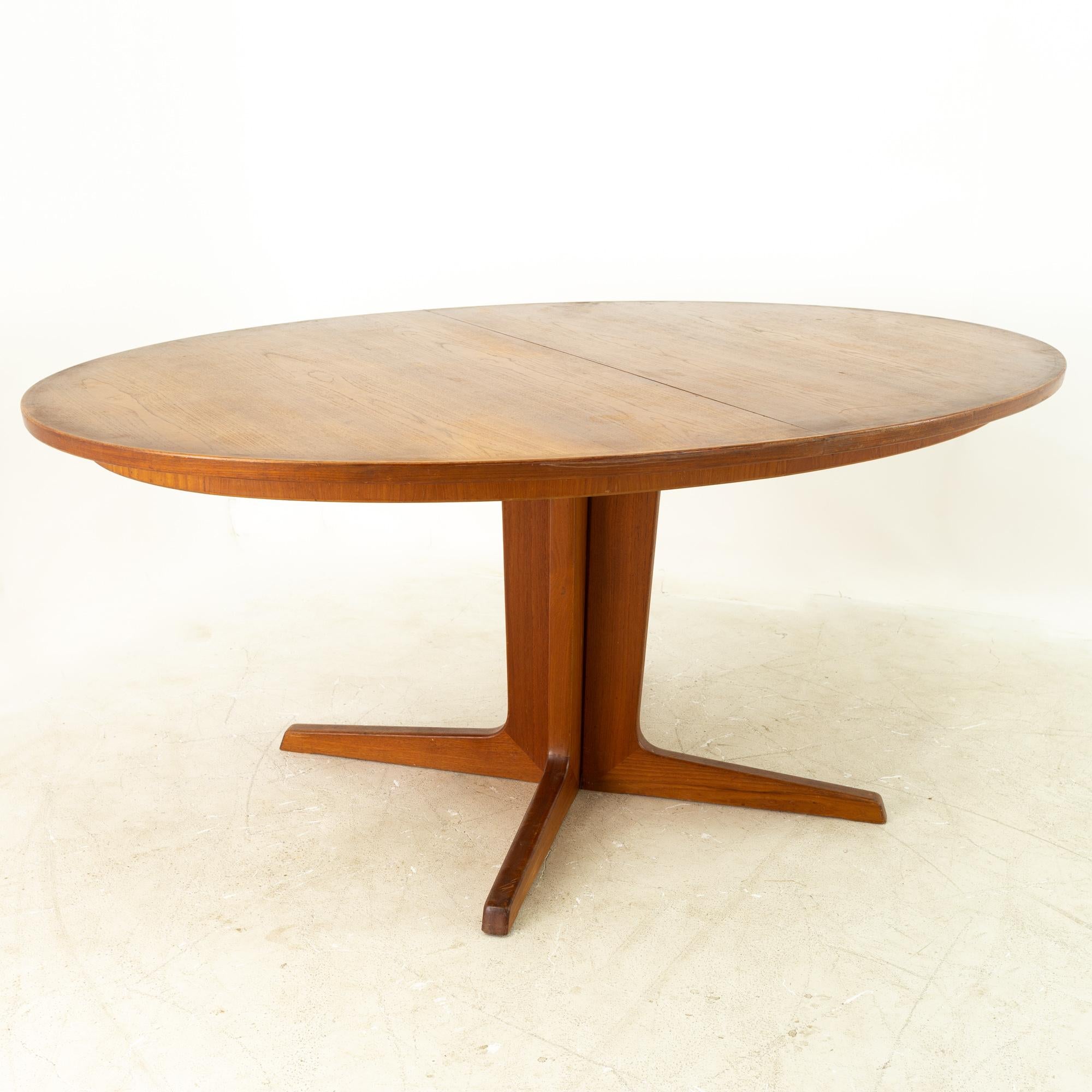 Niels Koefoeds for Uldum Mobelfabrik Mid Century Danish Teak Oval Dining Table

Measures: 68 wide x 44.75 deep x 28.5 high

This price includes getting this piece in what we call restored vintage condition. That means the piece is permanently fixed