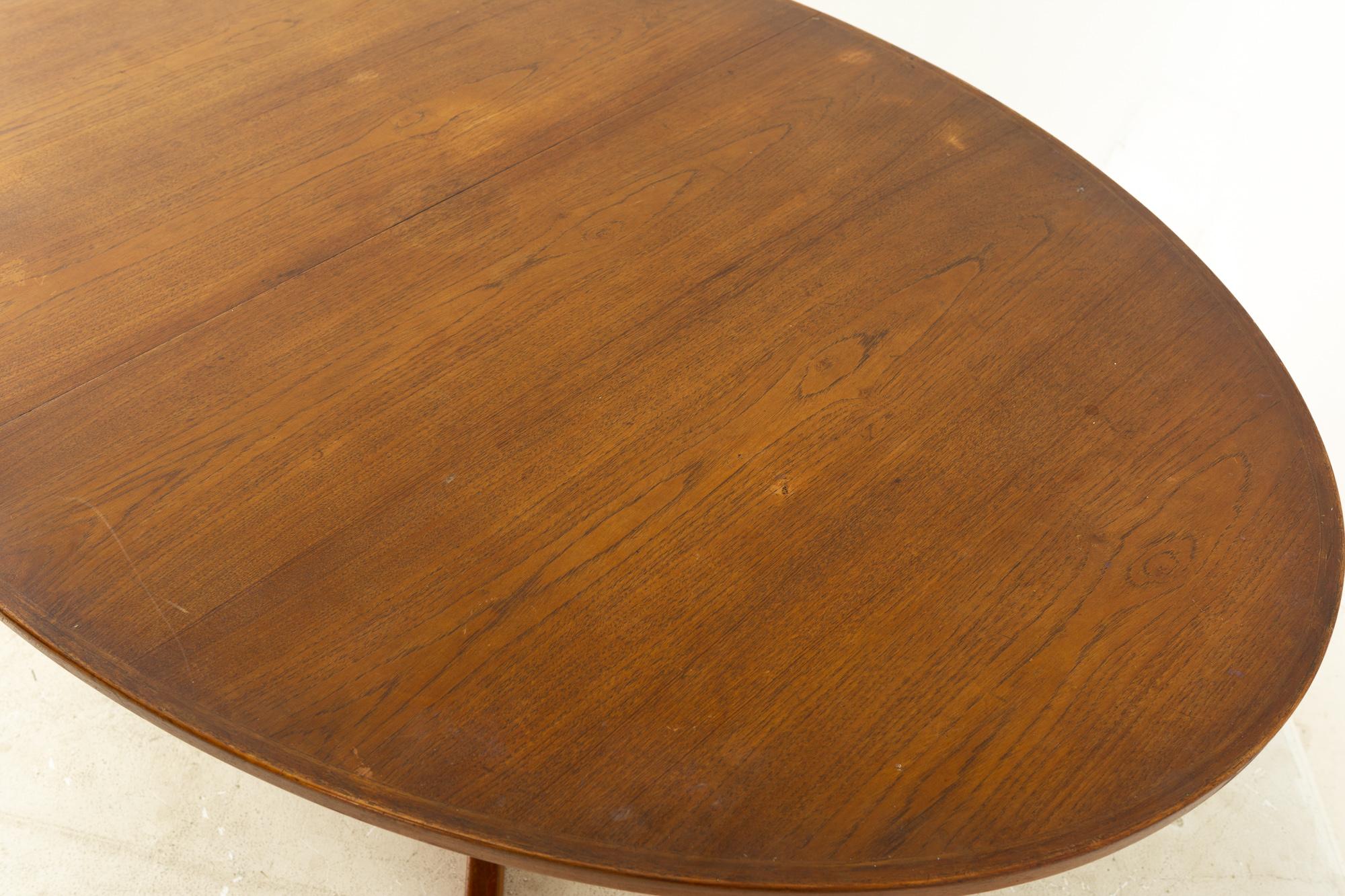 Niels Koefoeds for Uldum Mobelfabrik Mid Century Danish Teak Oval Dining Table In Excellent Condition In Countryside, IL