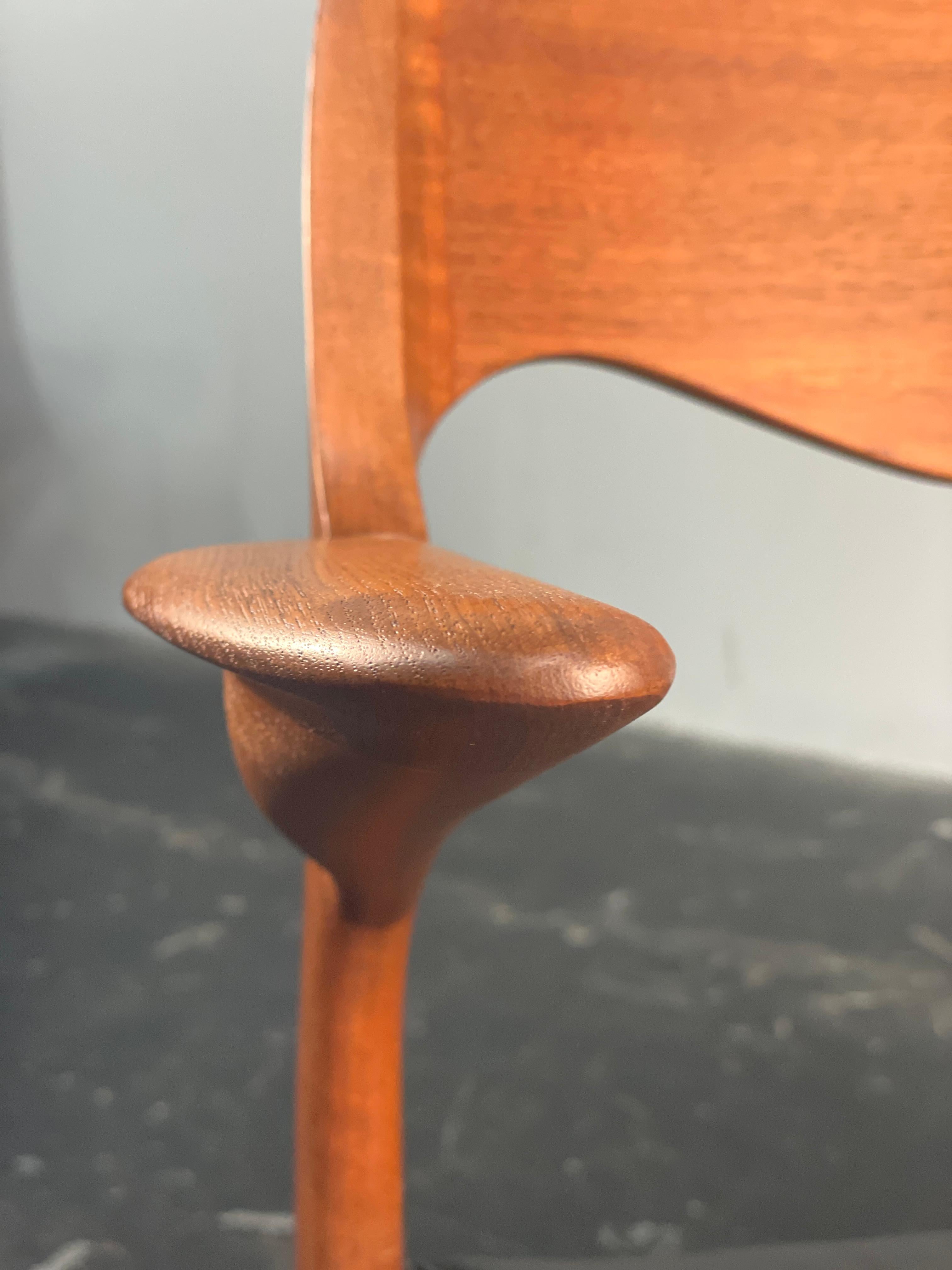 Solid Teak Moller 55 arm chair. This chair will work well as a desk chair or side chair.  Designed in 1951 By Niels Otto Møller and produced by J. L. Møllers Møbelfabrik. This chair has been completely refinished with a new leather seat. It has