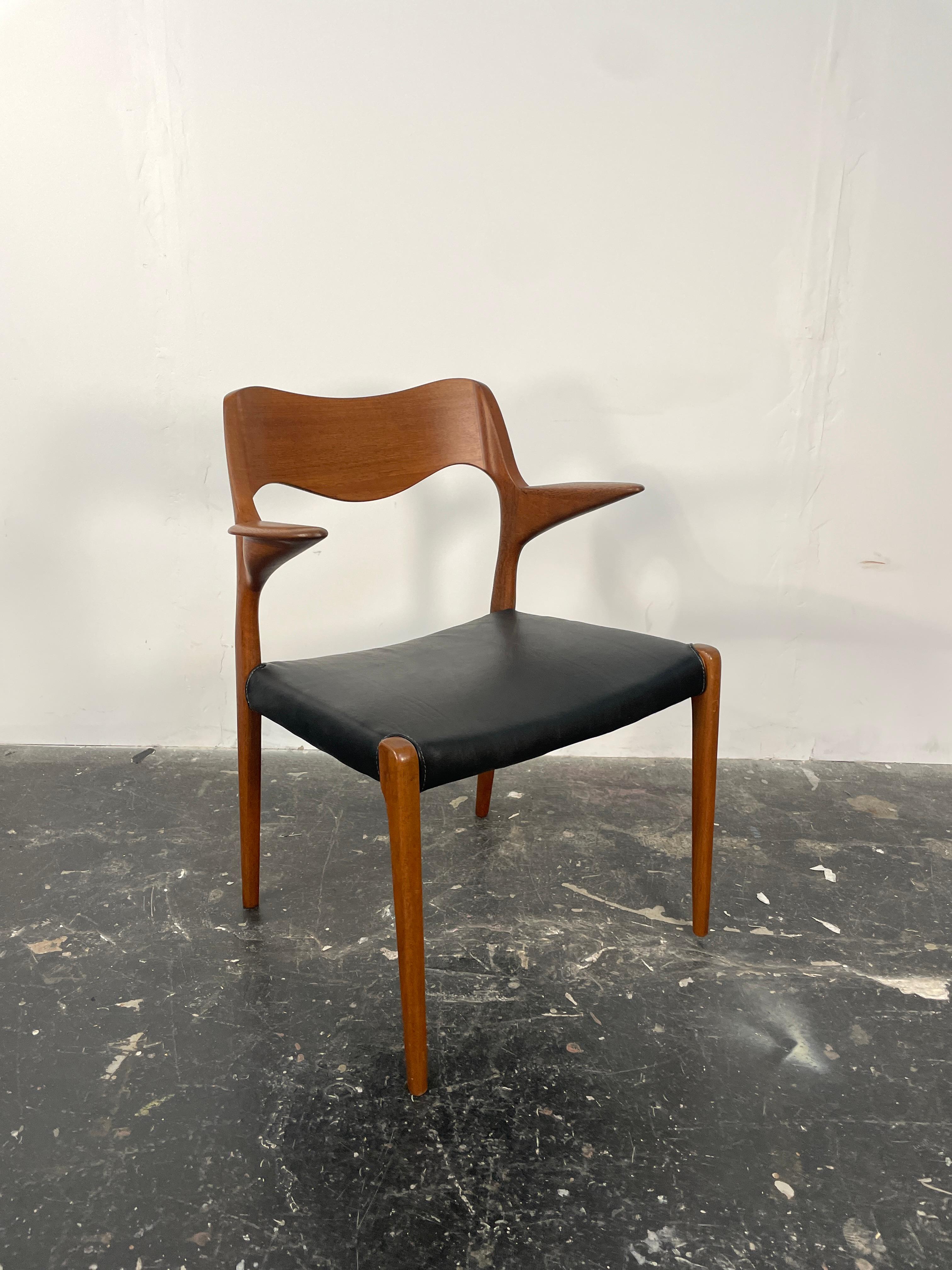 Scandinavian Modern Niels  Møller 55 arm chair in teak with new black leather seat