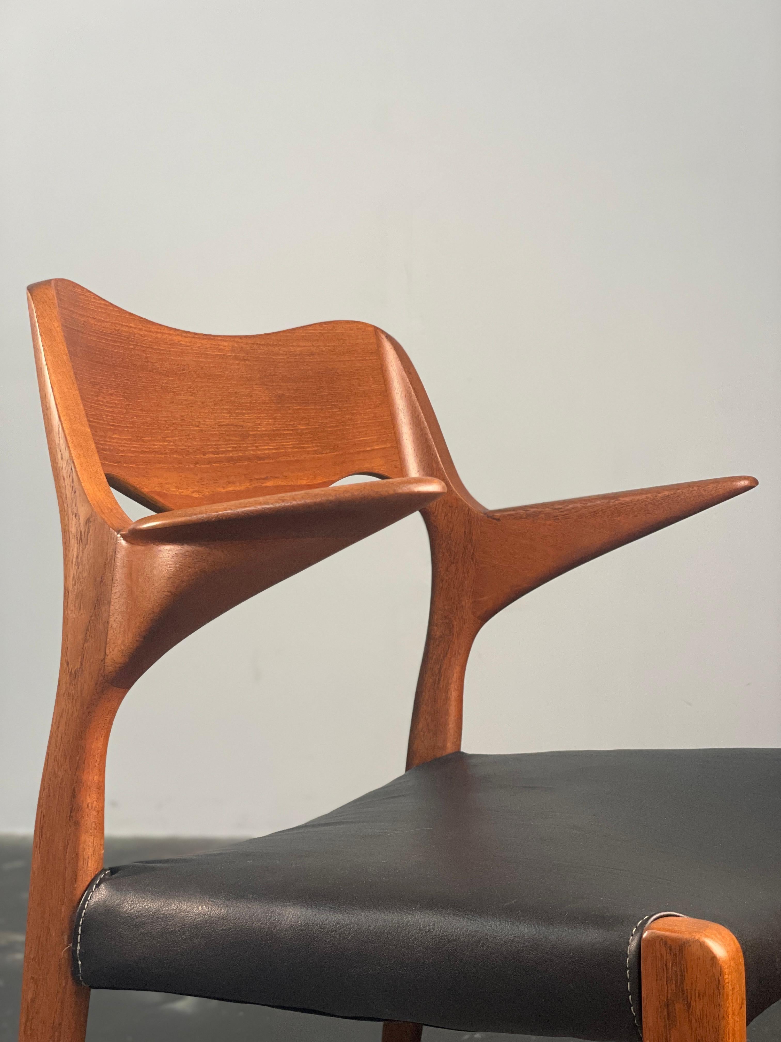 Lacquered Niels  Møller 55 arm chair in teak with new black leather seat