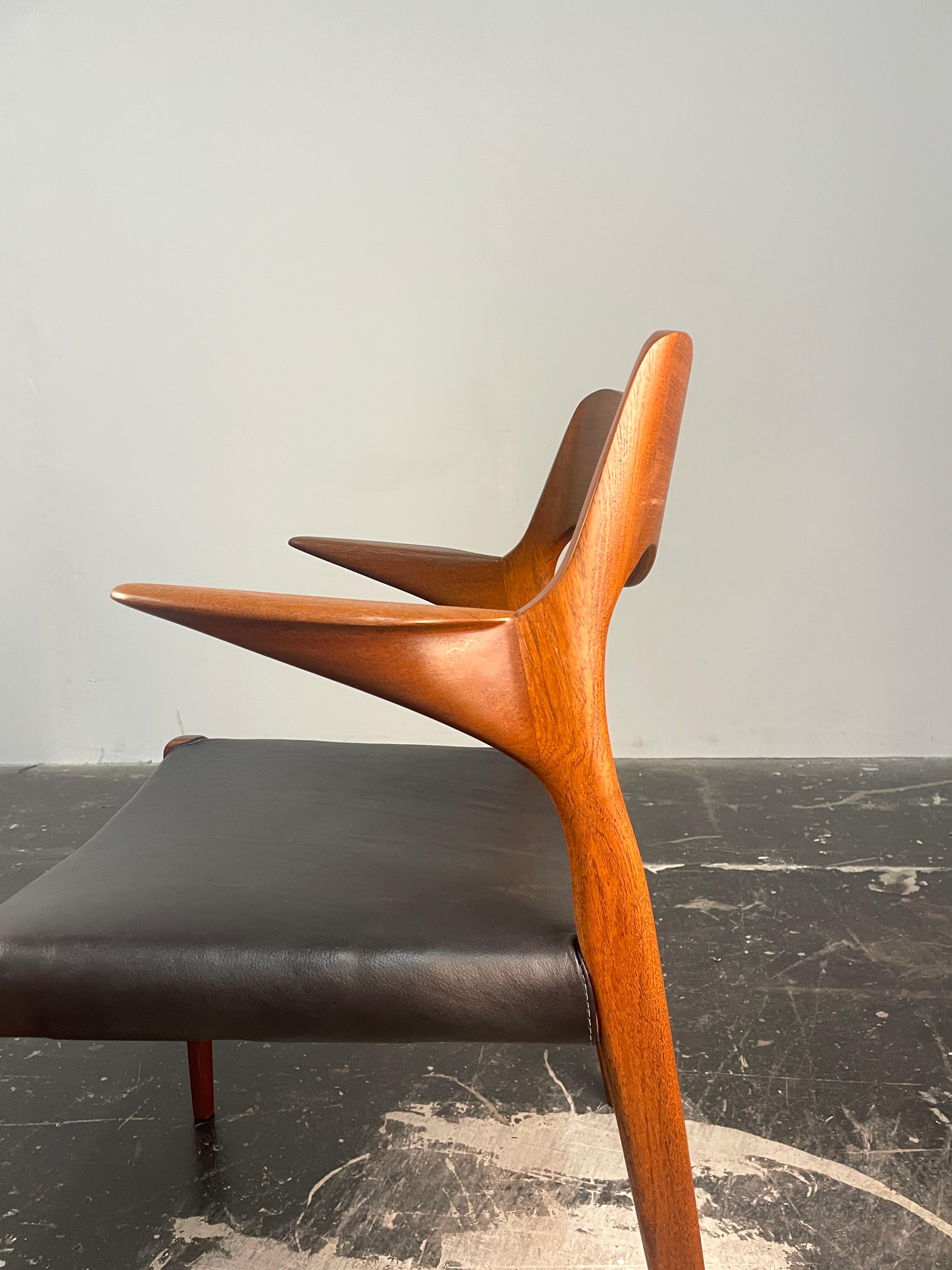 Leather Niels  Møller 55 arm chair in teak with new black leather seat