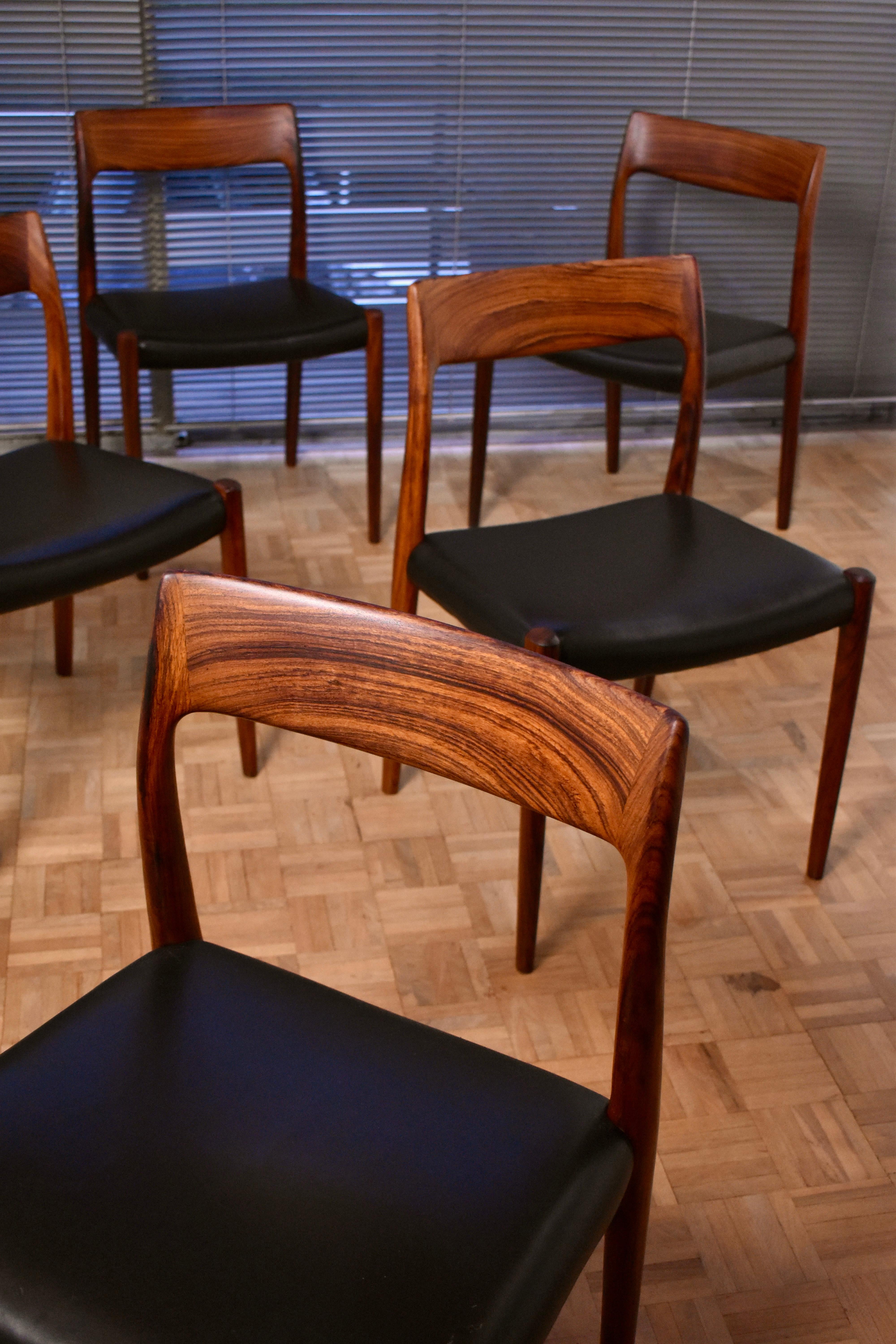 A particularly attractive set of six Niels Moller Model 77 solid rosewood chairs designed in 1959 for J.L Mollers Mobelfabrik.

This set exhibiting wonderful grain to the timber and lovely colour across the set. Each chair has been upholstered in