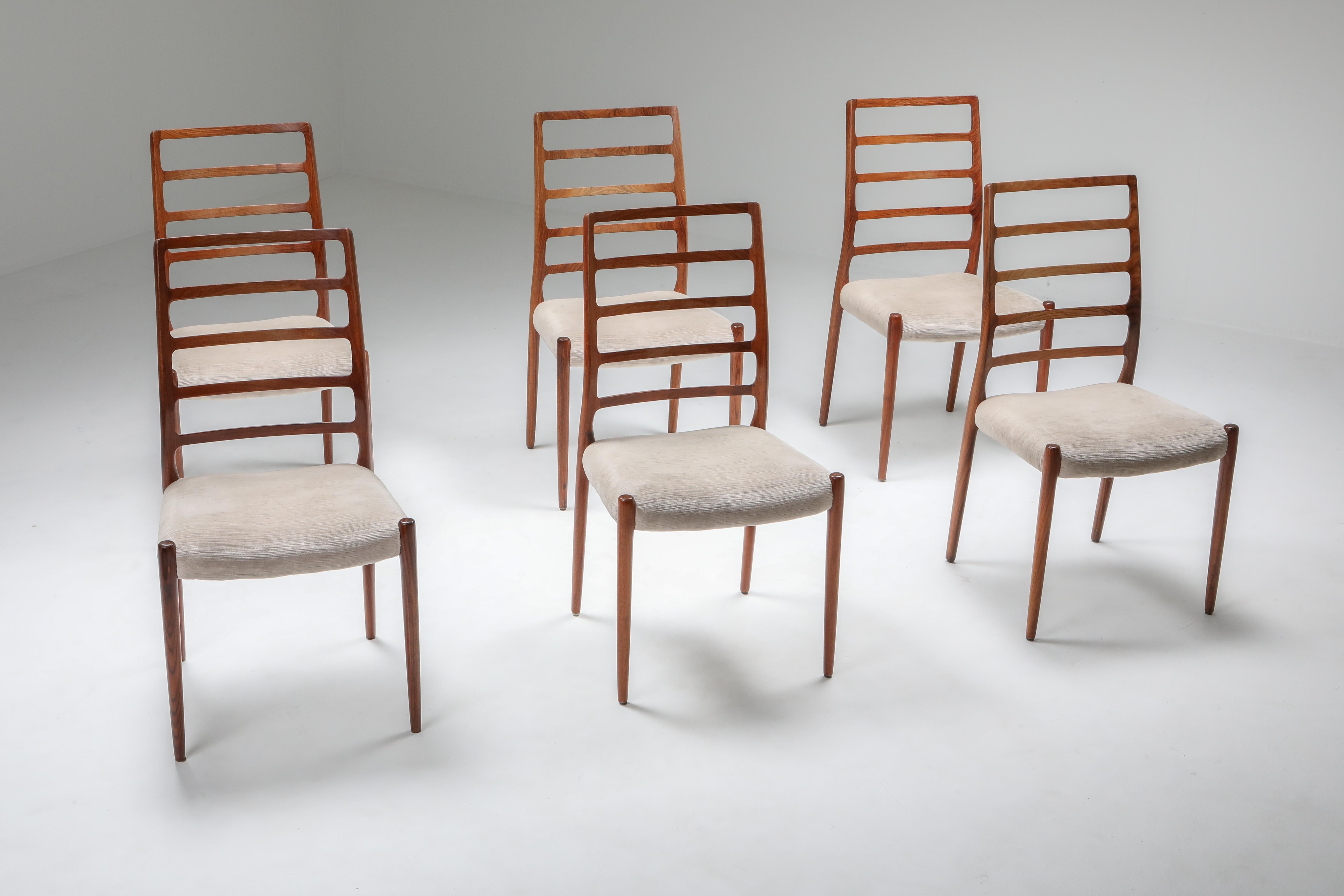 Niels Møller
Model 82 dining chairs, 1970
Set of 6 rosewood dining chairs designed by Niels O. Møller for J.L. Møller Møbelfabrik, Denmark in 1970. Features distinctive curved ladder back and ivory grey velvet seating.




