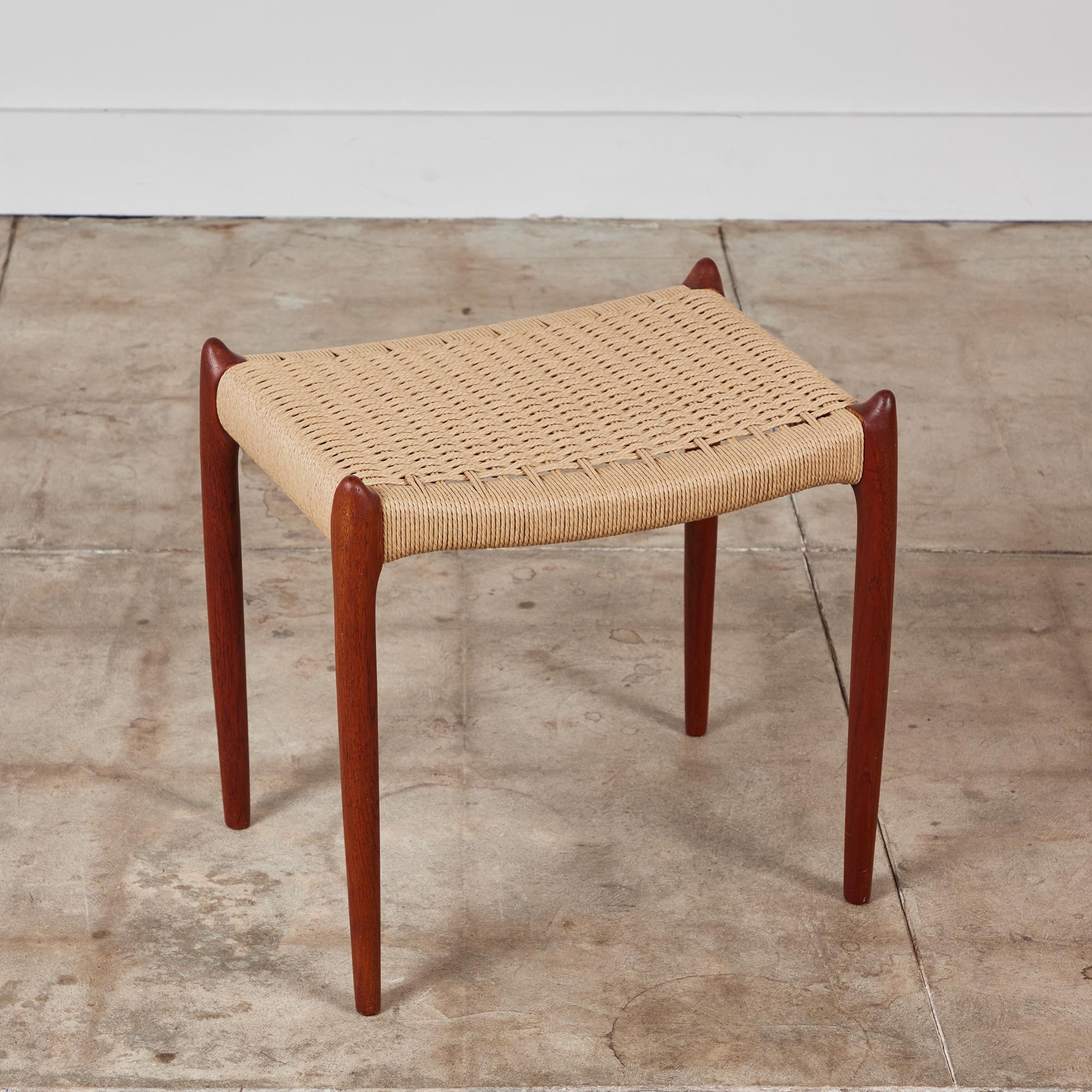 Niels Møller's Model 78A ottoman, designed in 1963 is a simple footrest with Danish cord upholstery and slightly tapered legs, manufactured by the designer's family company, JL Møllers Møbelfabrik. Danish cord three-ply, a twisted paper of superior
