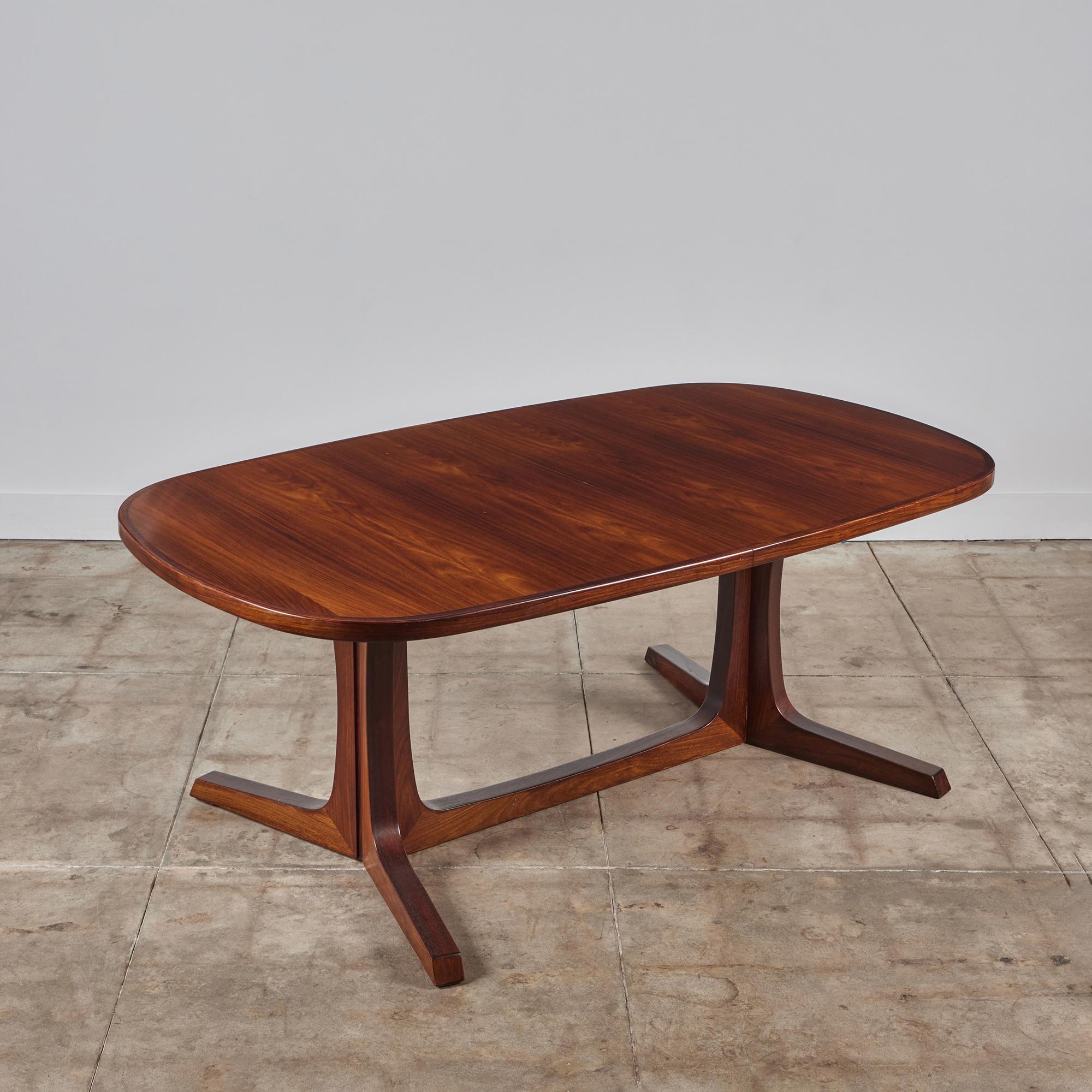Niels Møller dining table for Gudme Møbelfabrik c.1960s, Denmark. The table features a rectangular table top with rounded edges and two leaves that transform it to 113