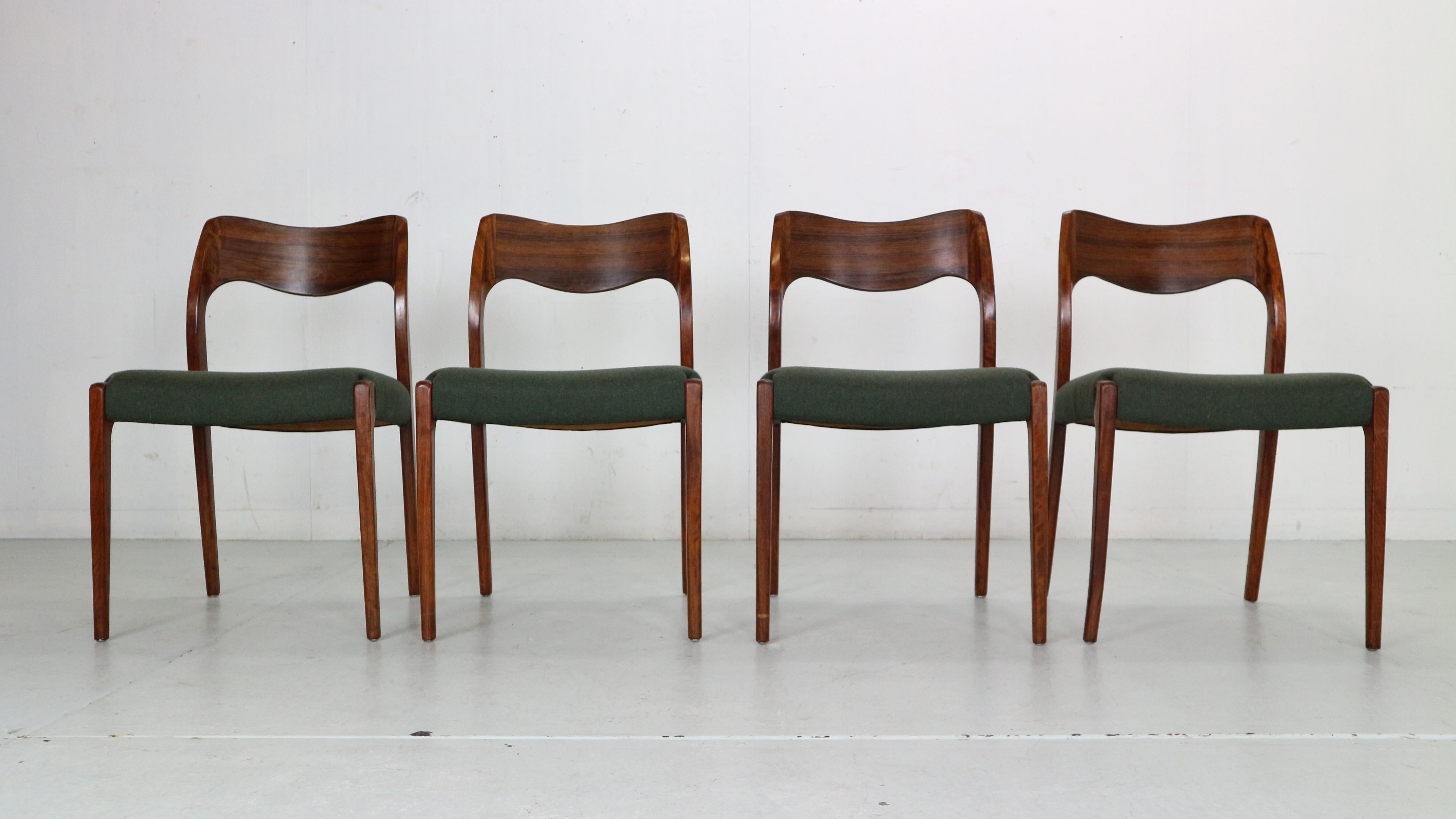 Set of 4 Danish Mid-Century Modern dining chairs by Niels Møller for J.L. Moller. 
Model number- 71.
Perfectly executed joinery connects the solid rosewood backrest to the rear legs and creates an expressive, sculptural form. The deep curve in the