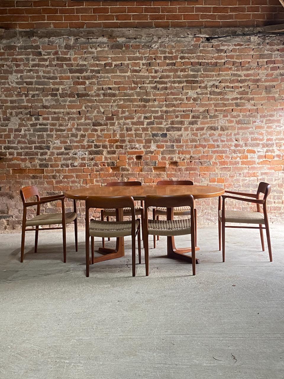 Niels Moller dining table and model 56 & model 75 teak dining chairs set of 6 1960.

Stunning mid century danish svend madsen circular teak double extending dining table matched with six Niels Otto Møller Teak & Paper Cord dining chairs manufactured