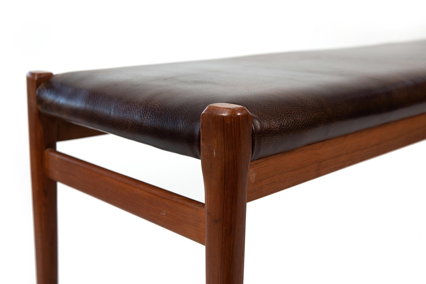 Niels Moller teak and leather bench circa mid-1960s. Original finish to solid teak frame and newly upholstered in a beautifully patinated leather.
