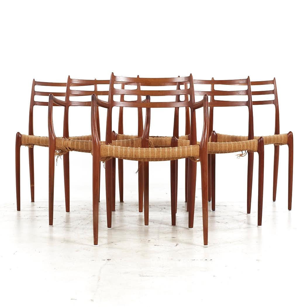 Niels Moller Mid Century Danish Teak and Cane Dining Chairs - Set of 6

Each armless chair measures: 19.5 wide x 18.5 deep x 32 high, with a seat height of 18.25 inches
Each captains chair measures: 21.75 wide x 20.5 deep x 32 high, with a seat
