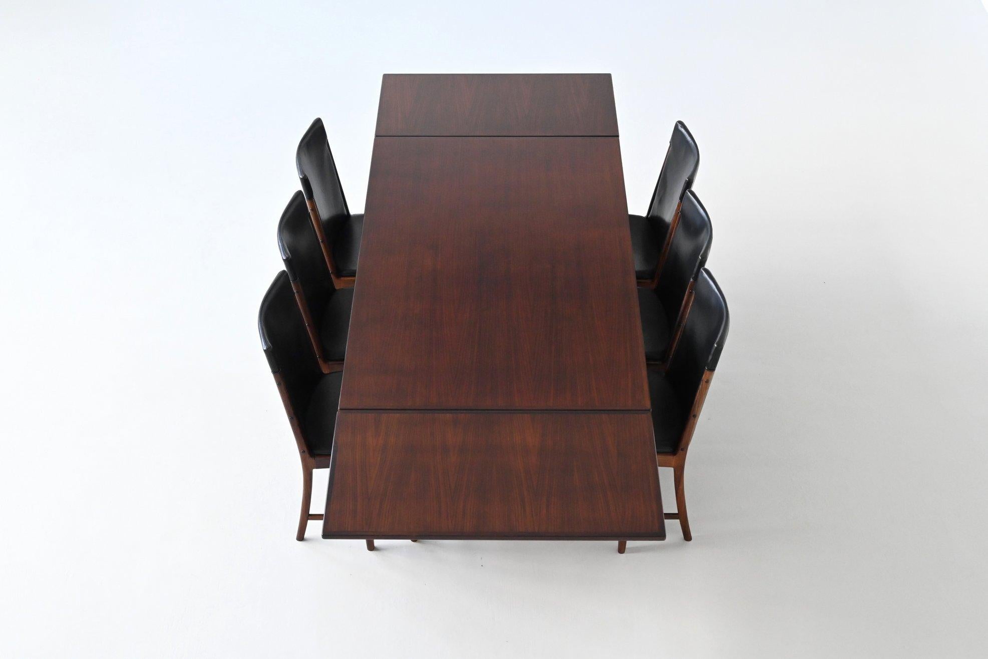 Beautifully crafted dining table model 254 designed by Niels Møller for J.L. Møllers Møbelfabrik, Denmark 1960. This well-crafted table is characterized by a strong and solid construction executed in rosewood. This is realized by the sharp and clear