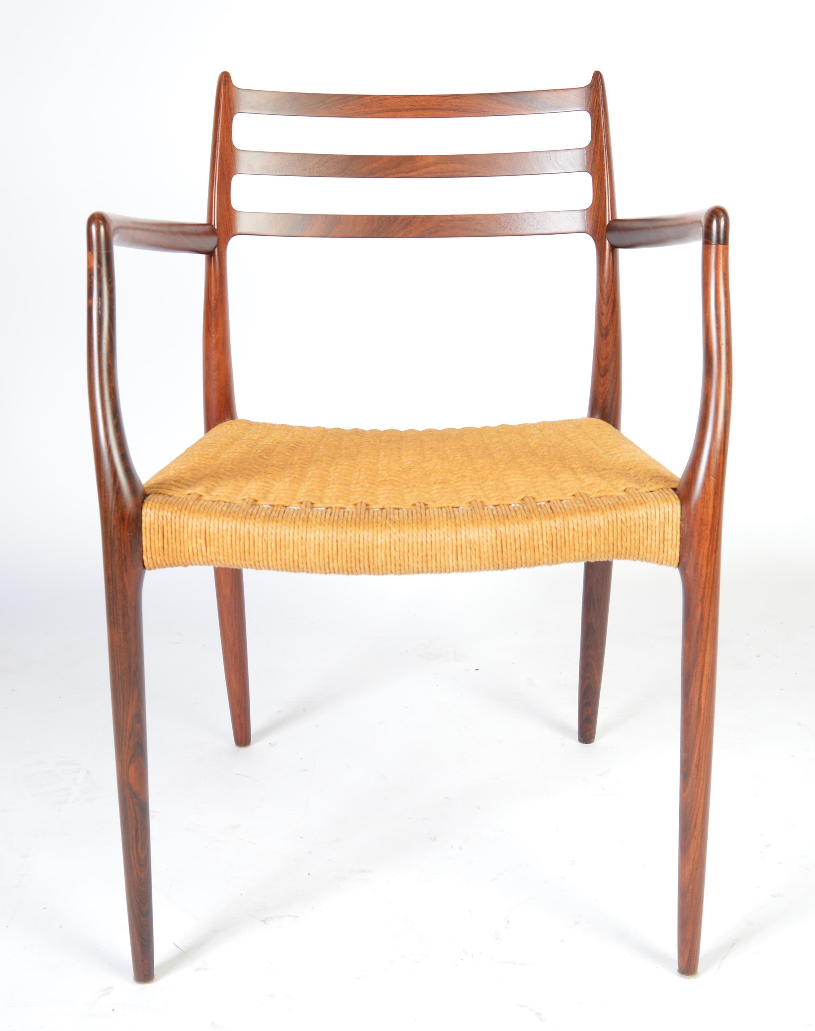 Vintage and nearly immaculate Niels Moller model 62 rosewood armchair having no chips or scratches to frame and perfect rope corded seat. Signed.
Measures: 32 x 21 x 20